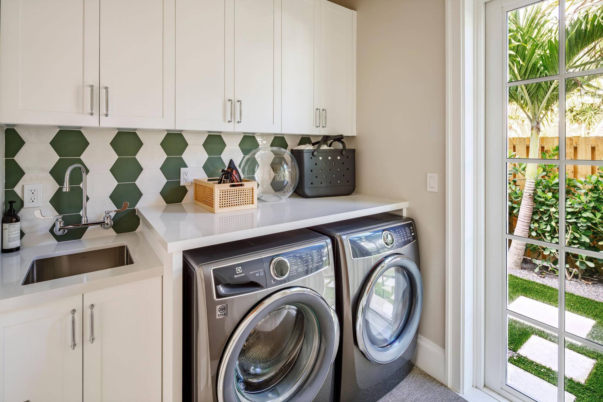 309 Greymon Drive, West Palm Beach, FL 33405 40 - Laundry room with white cabinets, g