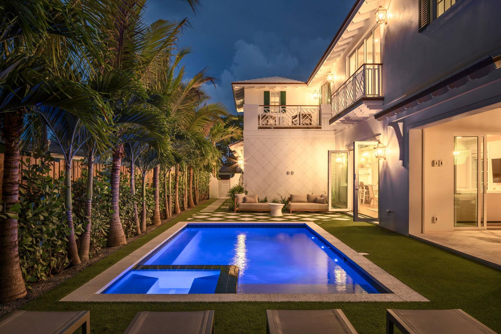 309 Greymon Drive, West Palm Beach, FL 33405 11 - Blue-lit pool with integrated spa a