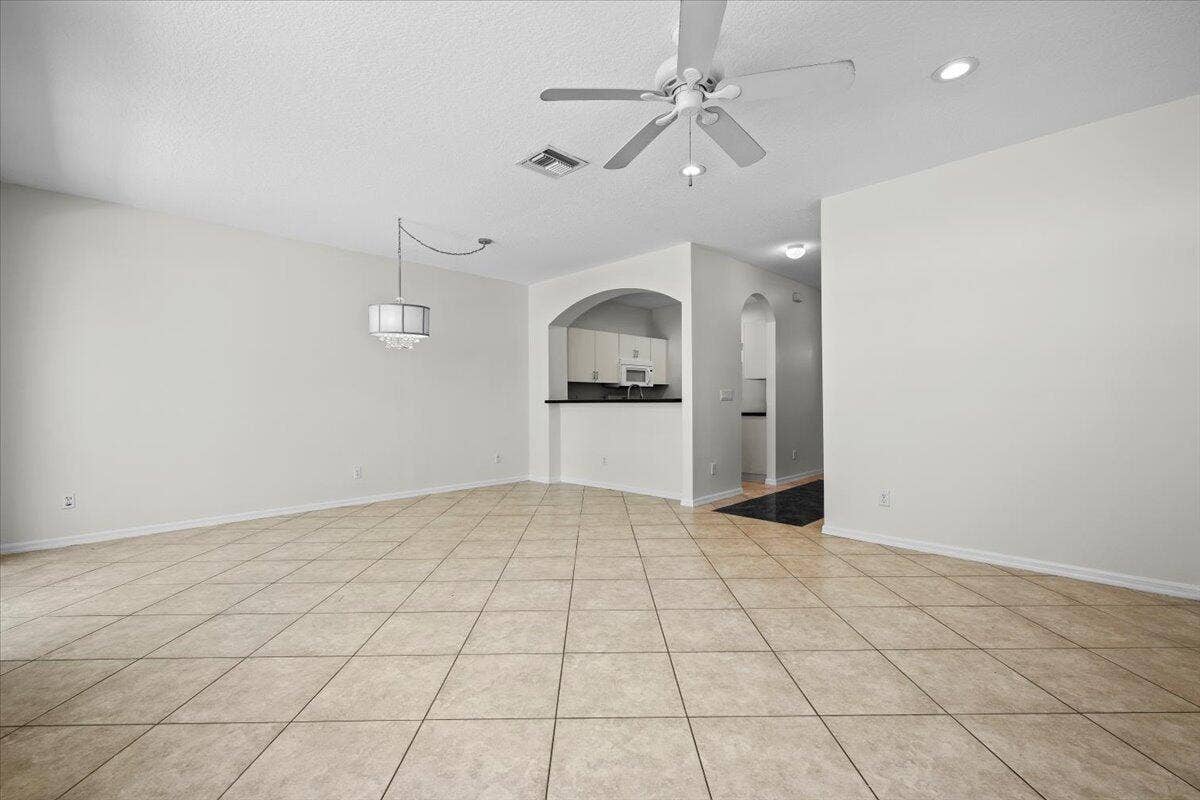 Spacious dining area with an open layout, neutral finishes, and plenty of natural light.