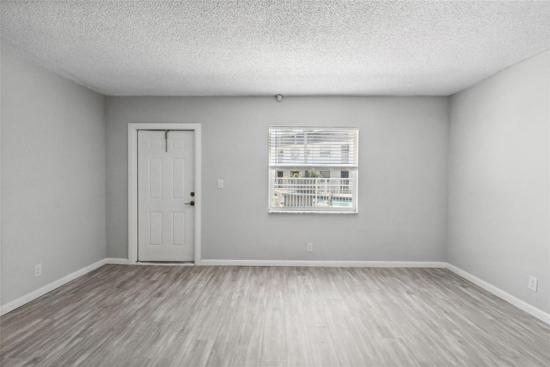 1470 N DIXIE Highway, #19, Fort Lauderdale, Fort Lauderdale, FL 33304 Impact window with view of pool
