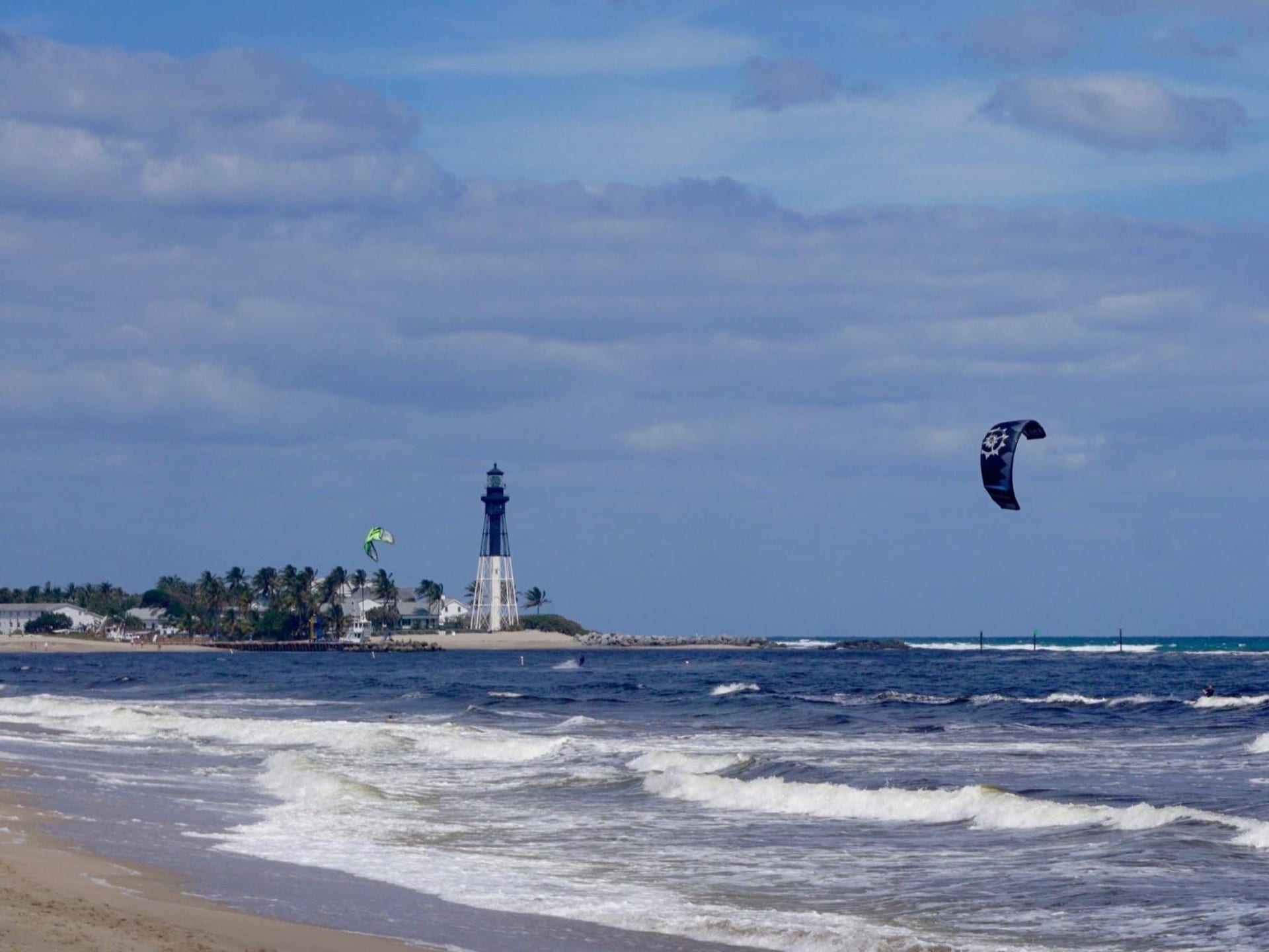 305 N POMPANO BEACH Boulevard, #206, Pompano Beach, Pompano Beach, FL 33062 Sandy shoreline with ocean waves and a prominent lighthouse backdrop