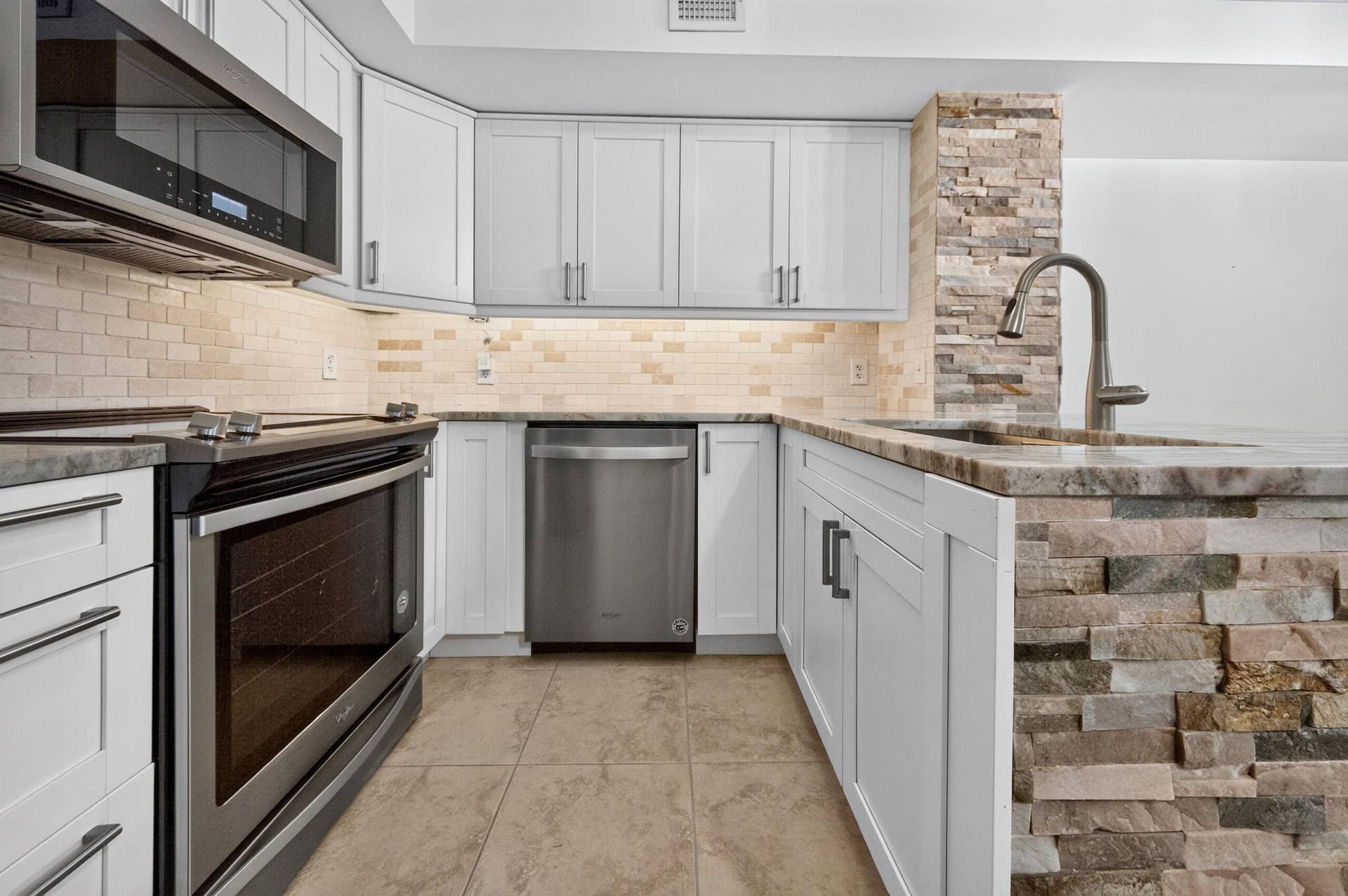 131 Yacht Club Way, #109, Hypoluxo, FL 33462 white wood cabinetry, soft closing, accent light