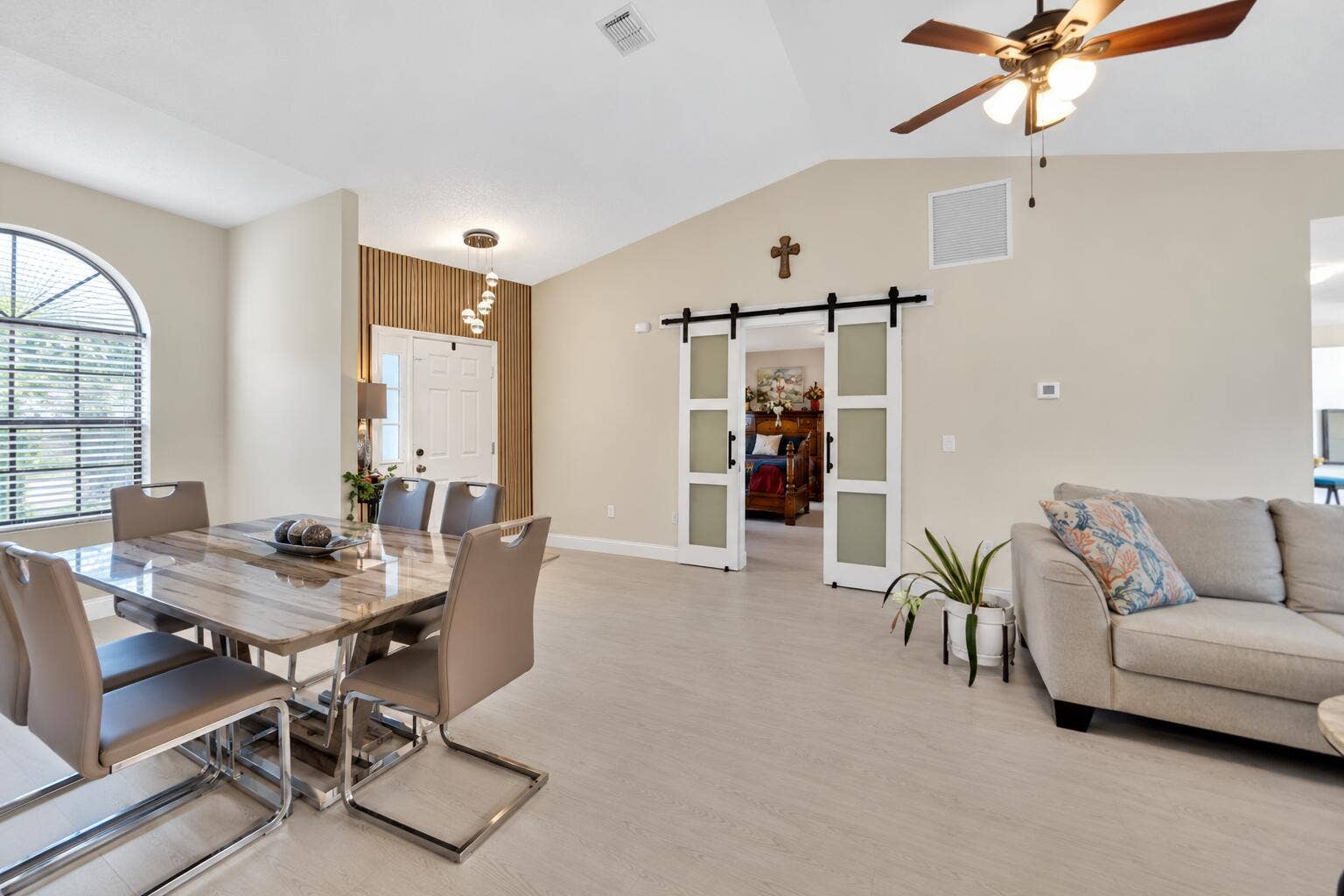 2268 SE LONGHORN Avenue, Port St Lucie, FL 34952 Modern Entryway with Wood Slat Accent Wa