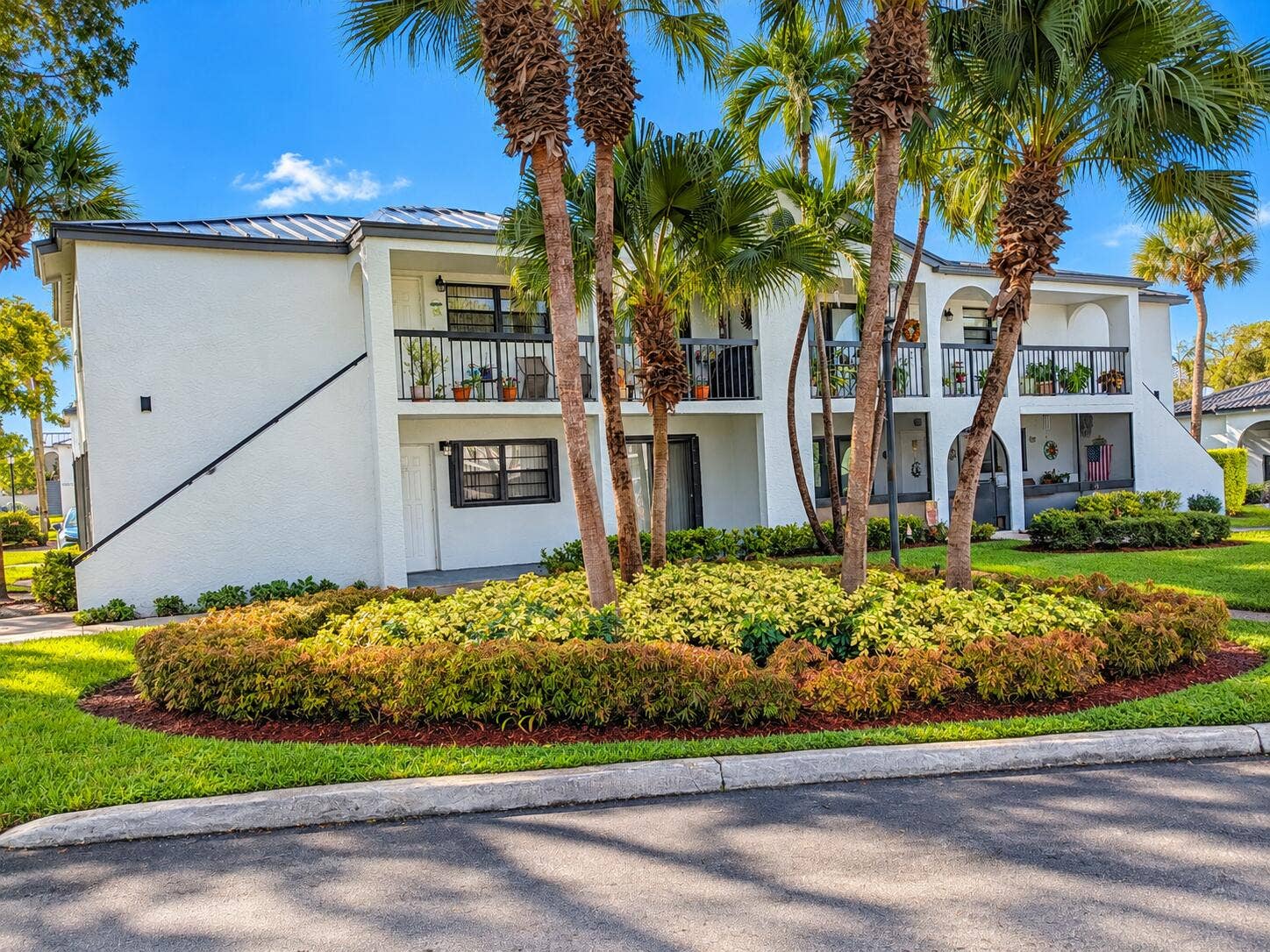 18286 MEDITERRANEAN Boulevard, #202, Hialeah, FL 33015 Tropical Palm-Framed Condominium Exterio