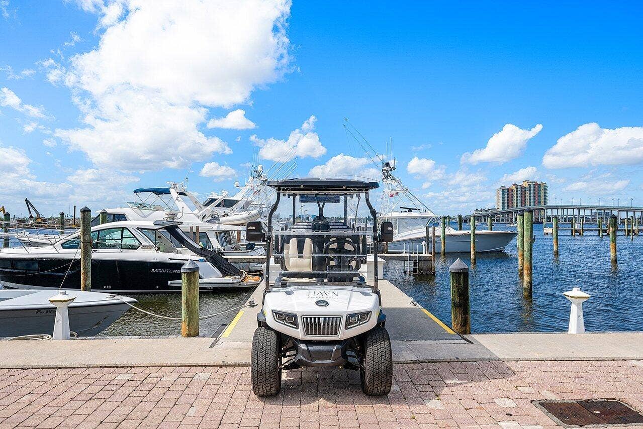 184 Lake Drive, #4201, Palm Beach Shores, FL 33404 Paved concrete pier featuring deep-water boat slips and wood pilings