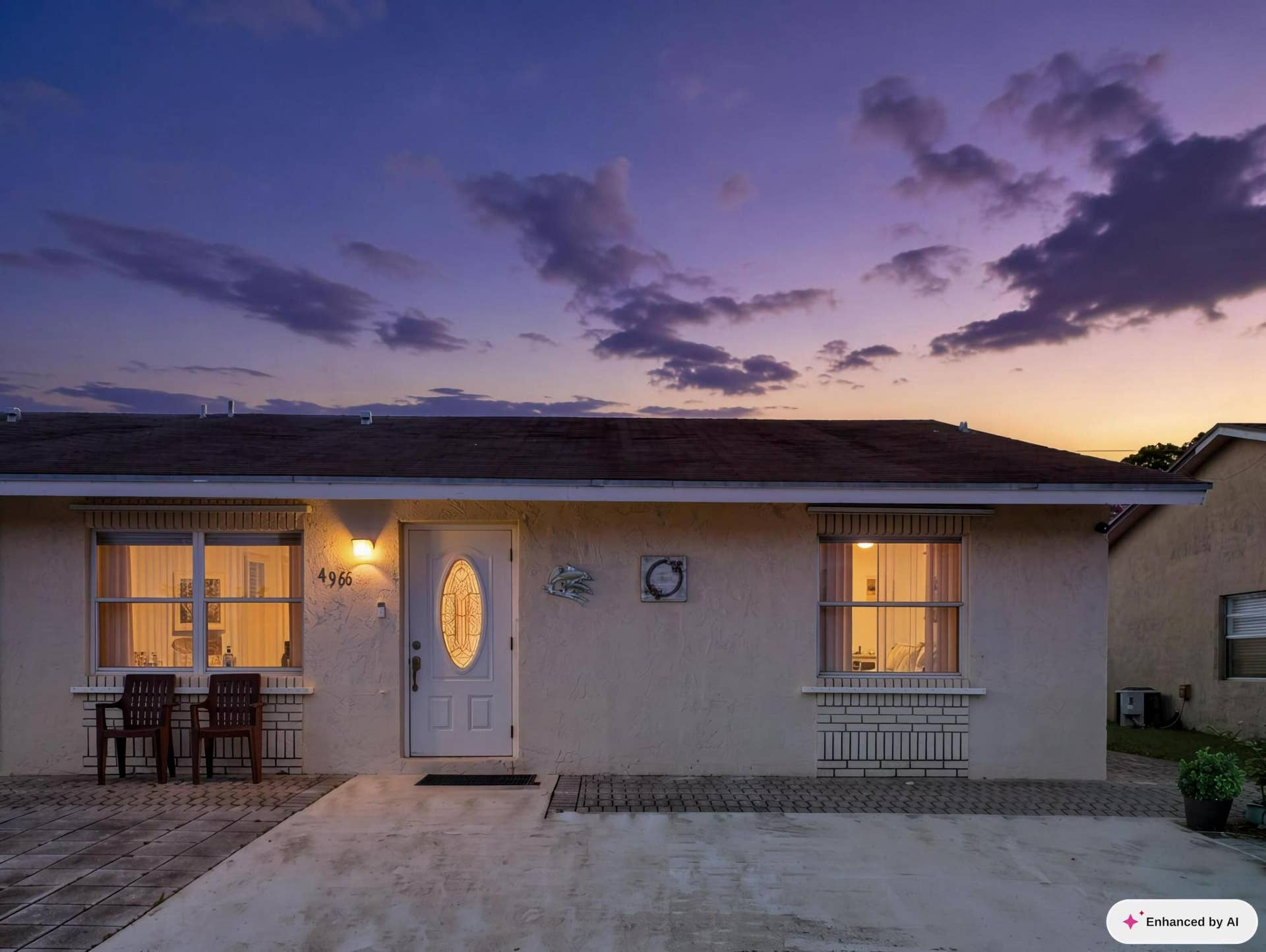 4966 PIMLICO Court, West Palm Beach, FL 33415 This image has been Ai Edited to illustrate the property's Dusk or Twilight View
