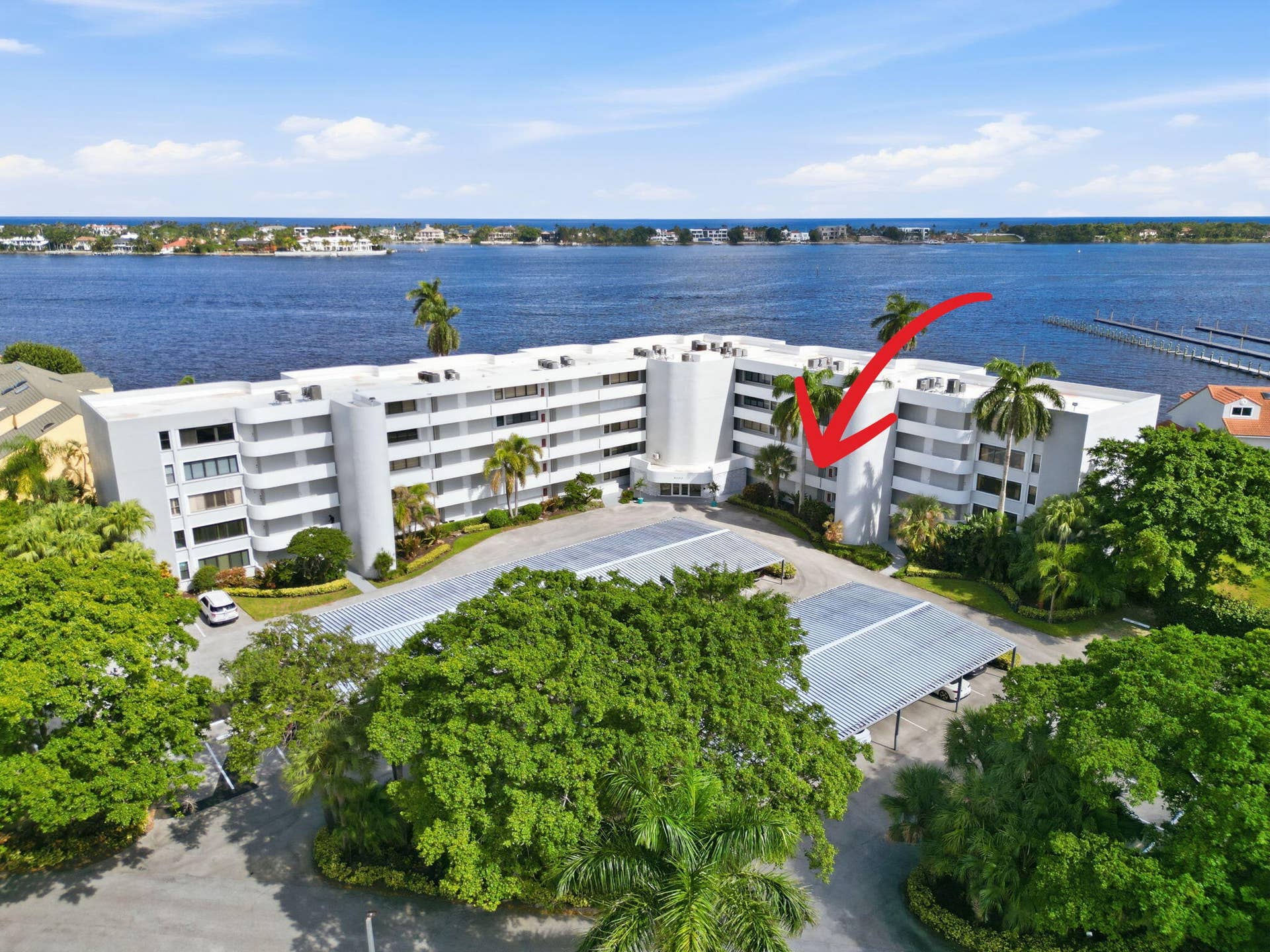 8200 Lakeshore Drive, #2020, Hypoluxo, FL 33462 droneofbuildingarrowwaterbackground