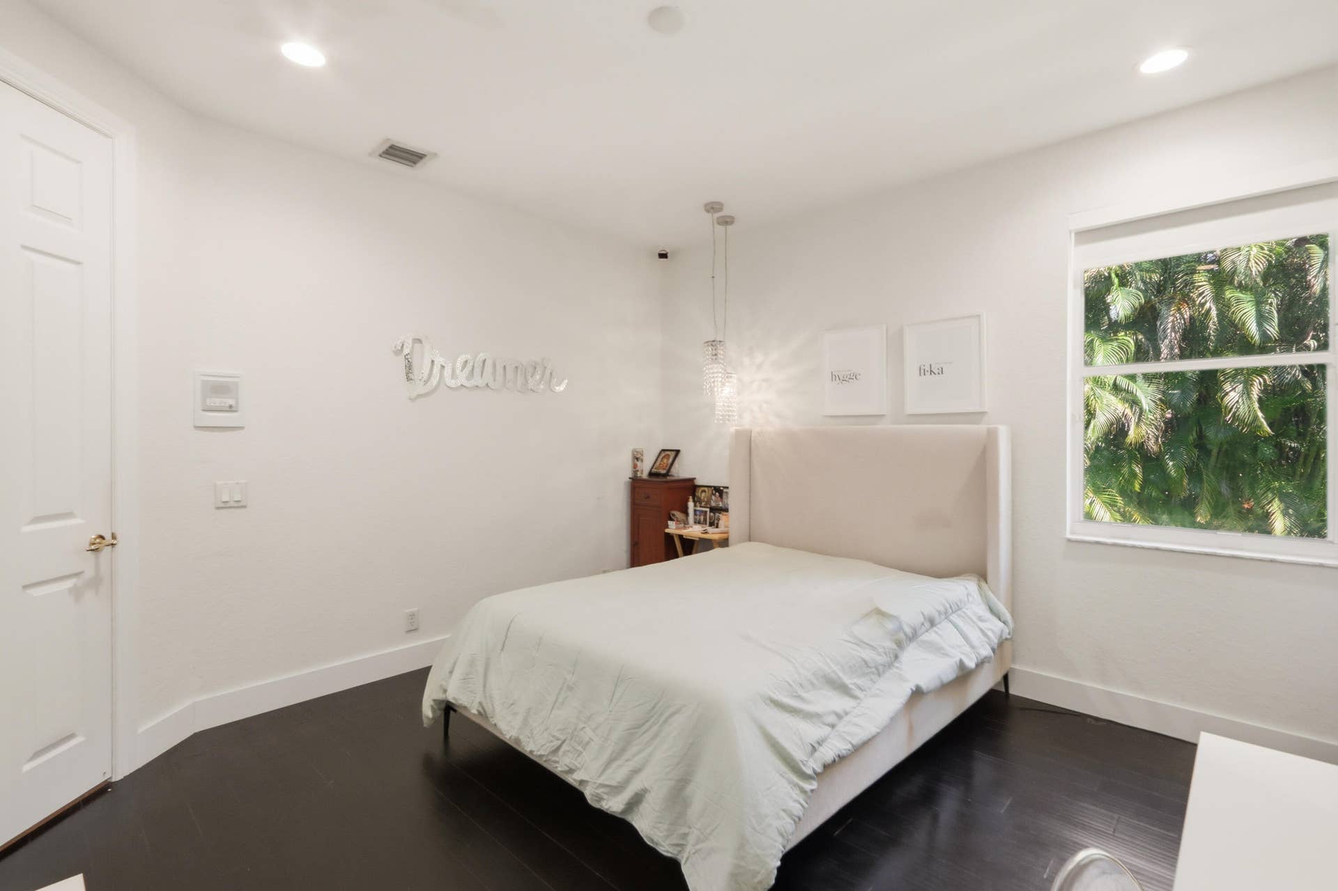 1580 VICTORIA ISLE Way, Weston, FL 33327 Bedroom featuring dark wood-finish flooring, recessed lighting, a multi-bulb hanging pendant light, and a window with natural scenery