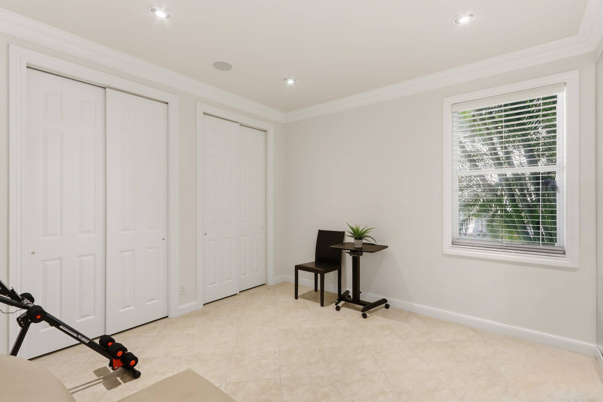 1580 VICTORIA ISLE Way, Weston, FL 33327 Neutral-toned tile flooring, recessed ceiling lighting, crown molding, and two sets of double-panel closet doors