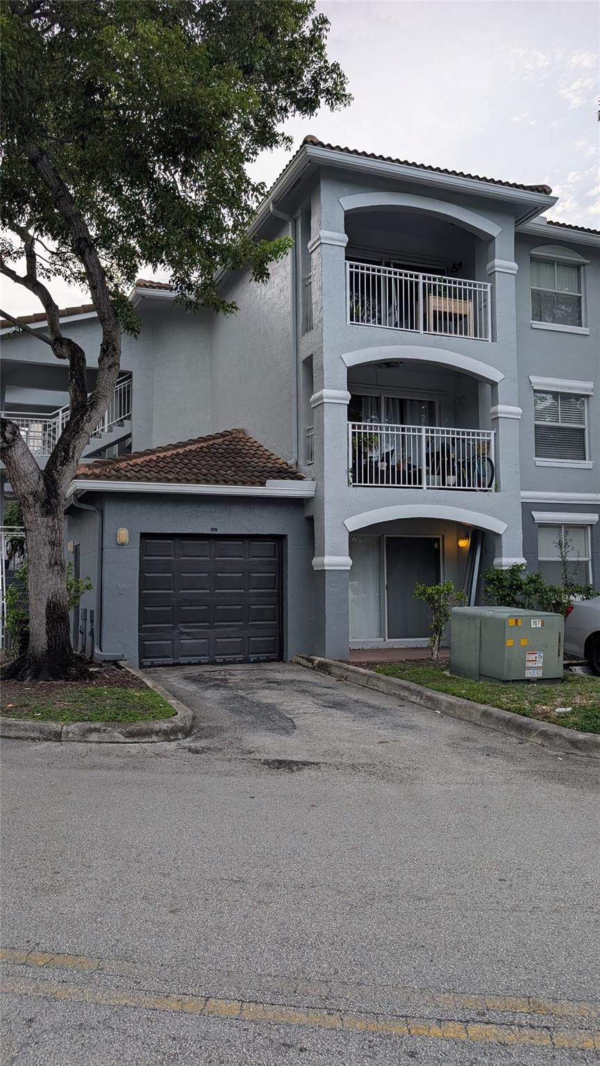 Front of building and unit's garage 9-1