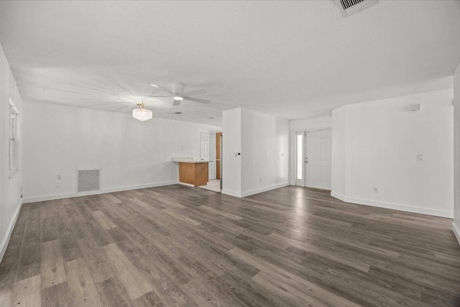 113 CONOVER Avenue, Sebastian, FL 32958 Open living area featuring wood-finish flooring, recessed lighting, a ceiling fan, and a neutral color palette