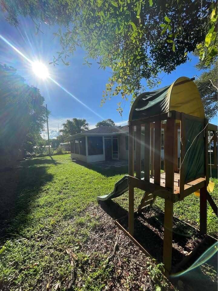 2616 Newport Drive, Fort Pierce, FL 34982 yard with playset