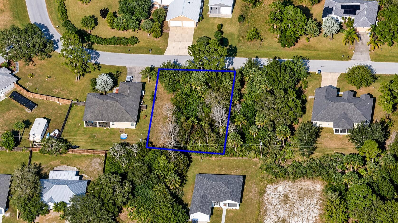 1066 WEBSTER Road SE, Palm Bay, FL 32909 Aerial View of Blue-Outlined Woodland Lo