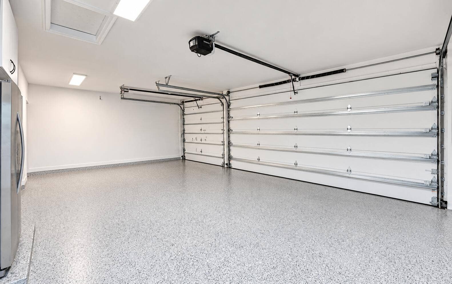 New epoxy floors, newly installed impact garage doors and remoteless garage door openers.