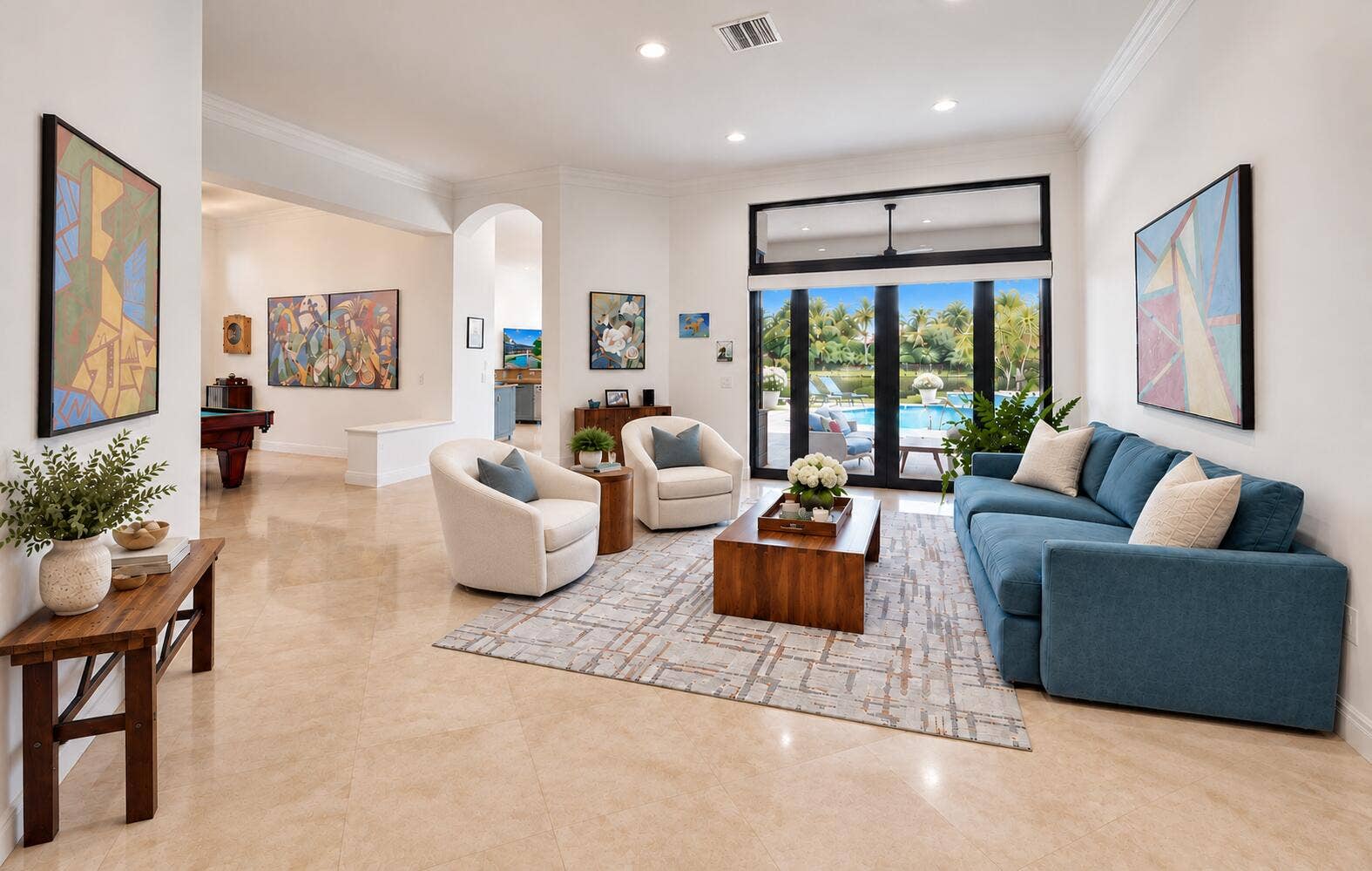Living room with floor to ceiling impact sliding glass doors