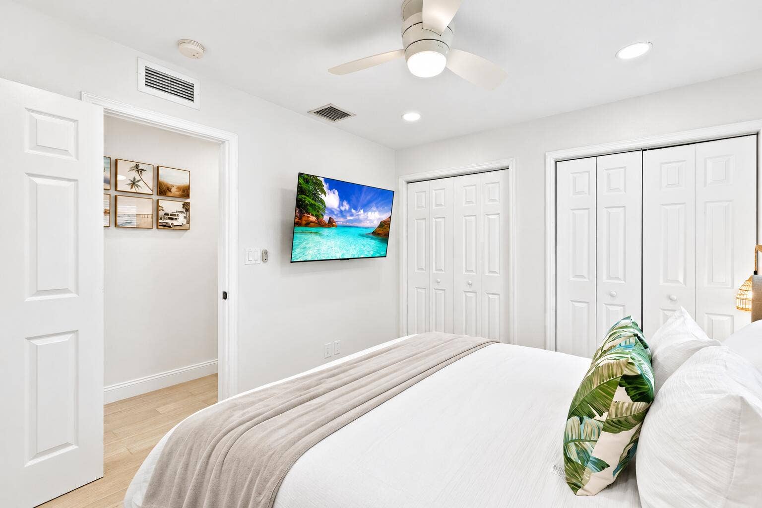 Bright Coastal Bedroom with Tropical Vie
