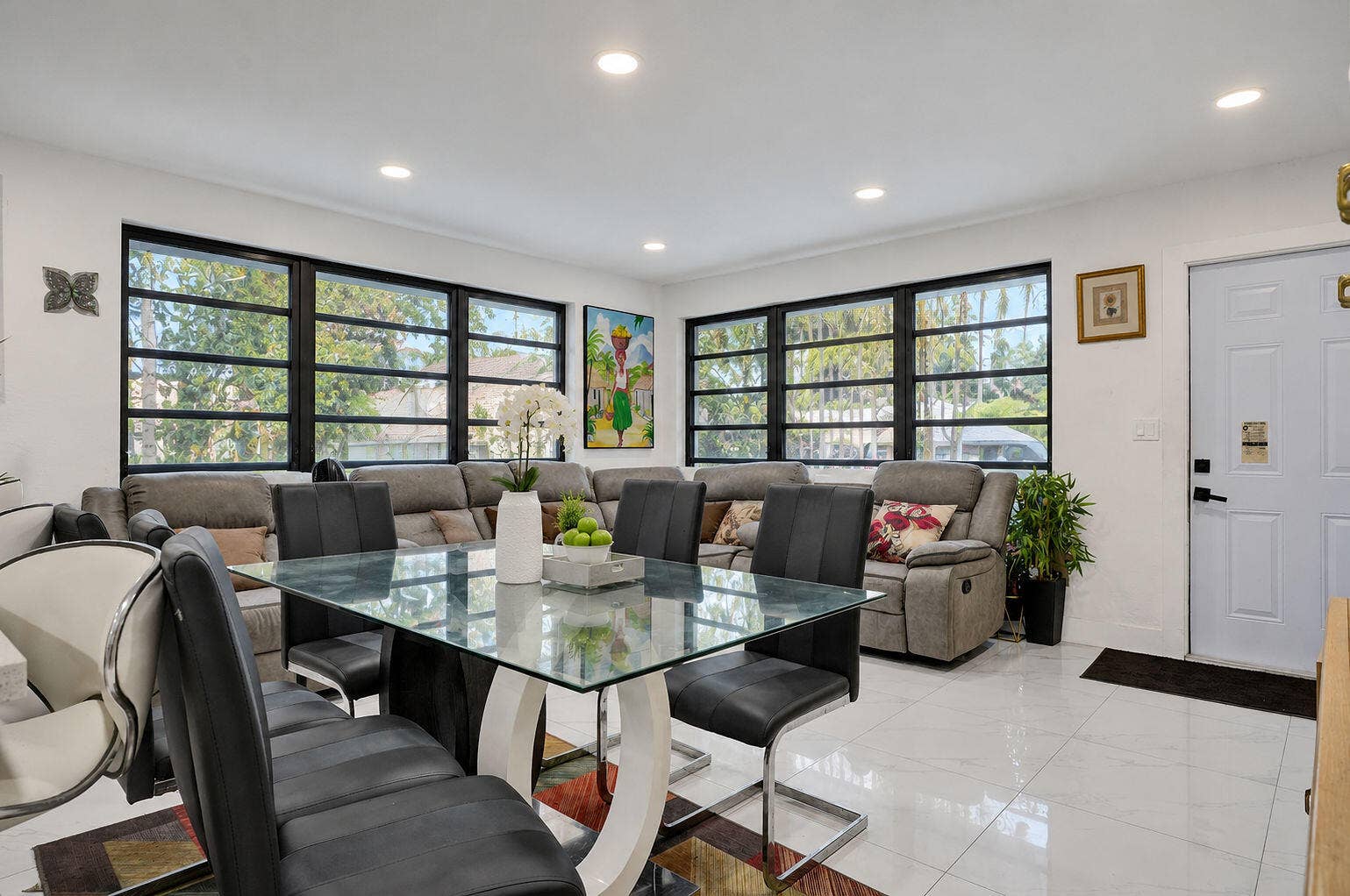 1946 NW 152nd Terrace, Miami Gardens, FL 33054 Large-format windows with black frames, recessed ceiling lighting, and polished stone-finish flooring