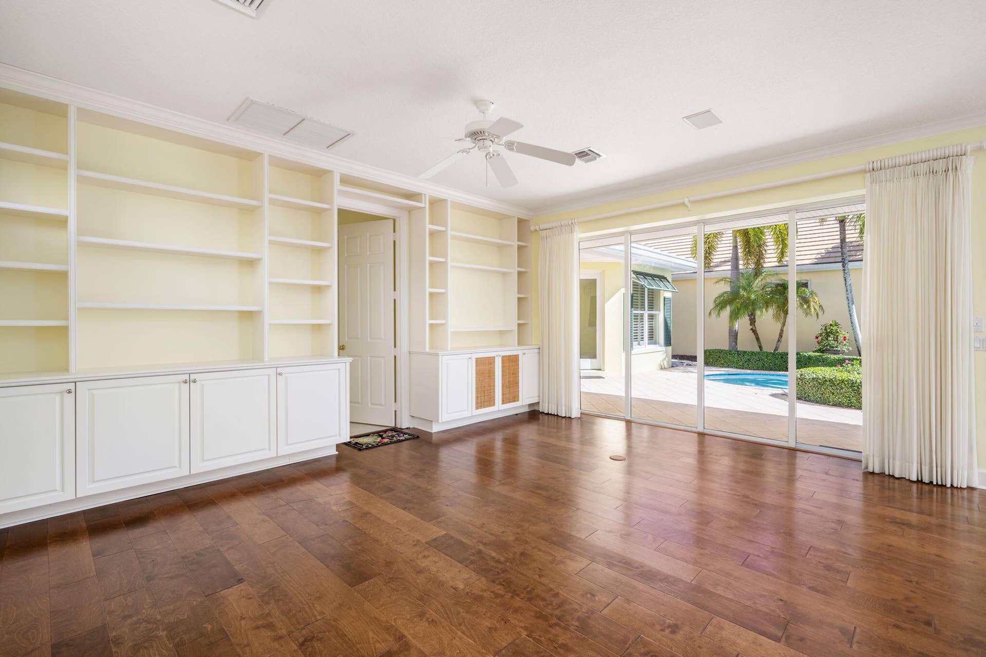 light and bright custom built ins expansive views of courtyard pool