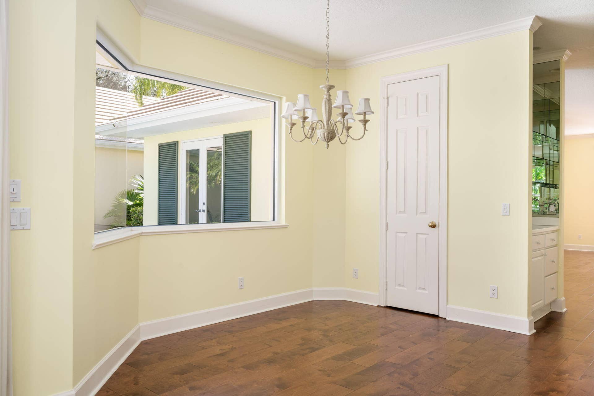 Eat in kitchen with lovely courtyard pool views, pantry closet