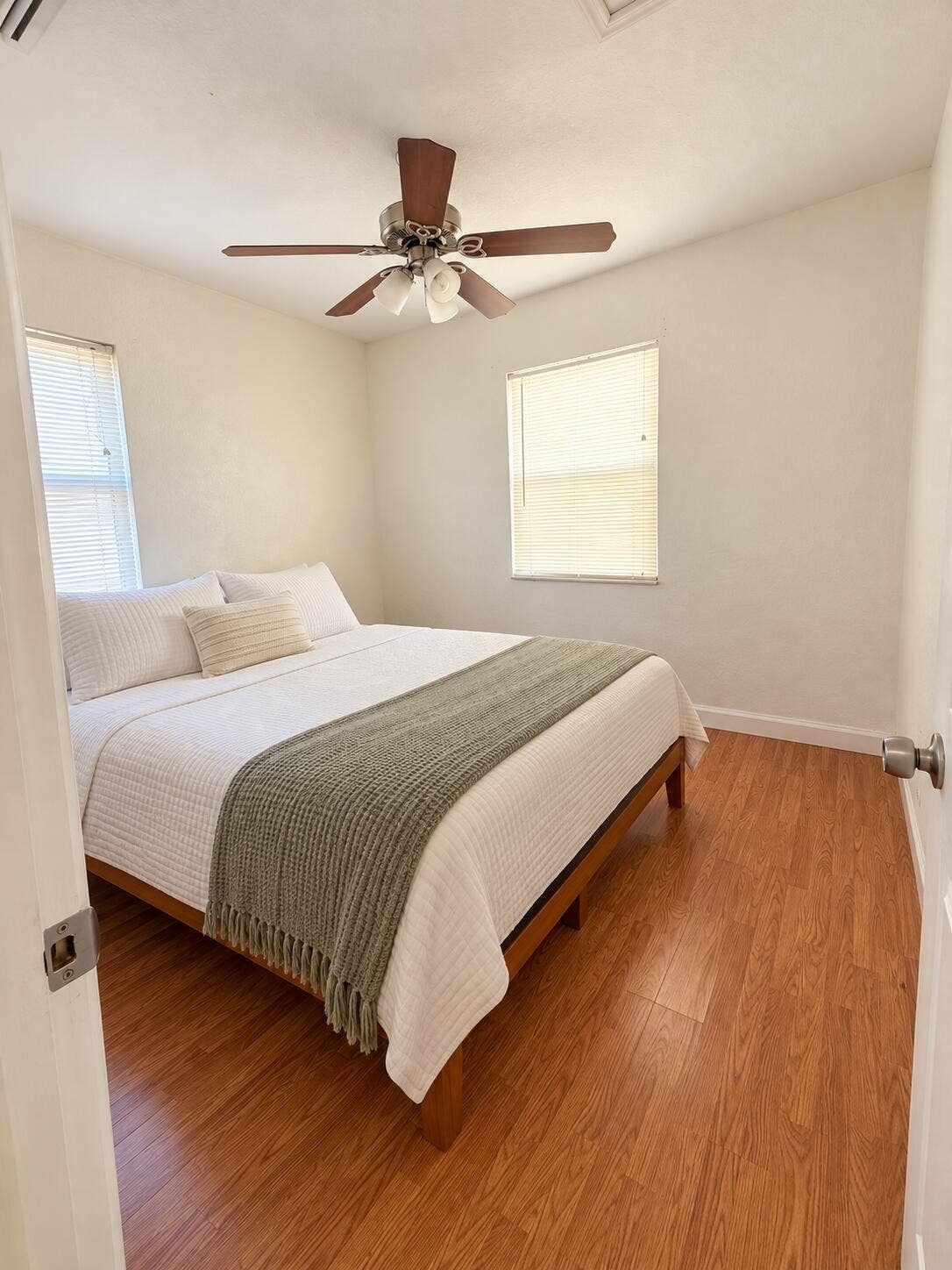 Bright Minimalist Bedroom with Sage Thro