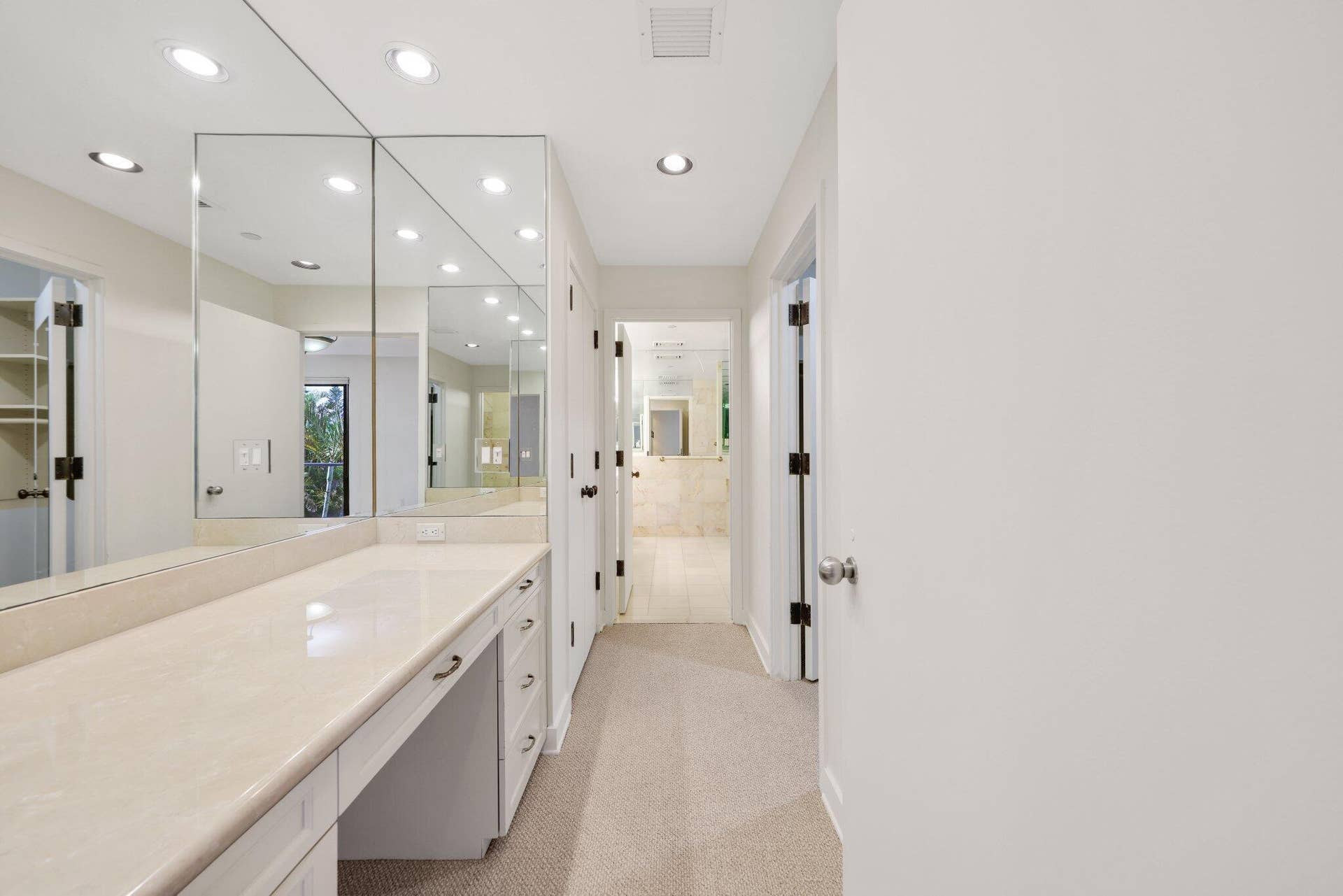 Primary Suite Makeup Area/Multiple Closets/Path to His/Her En-Suite Bathroom