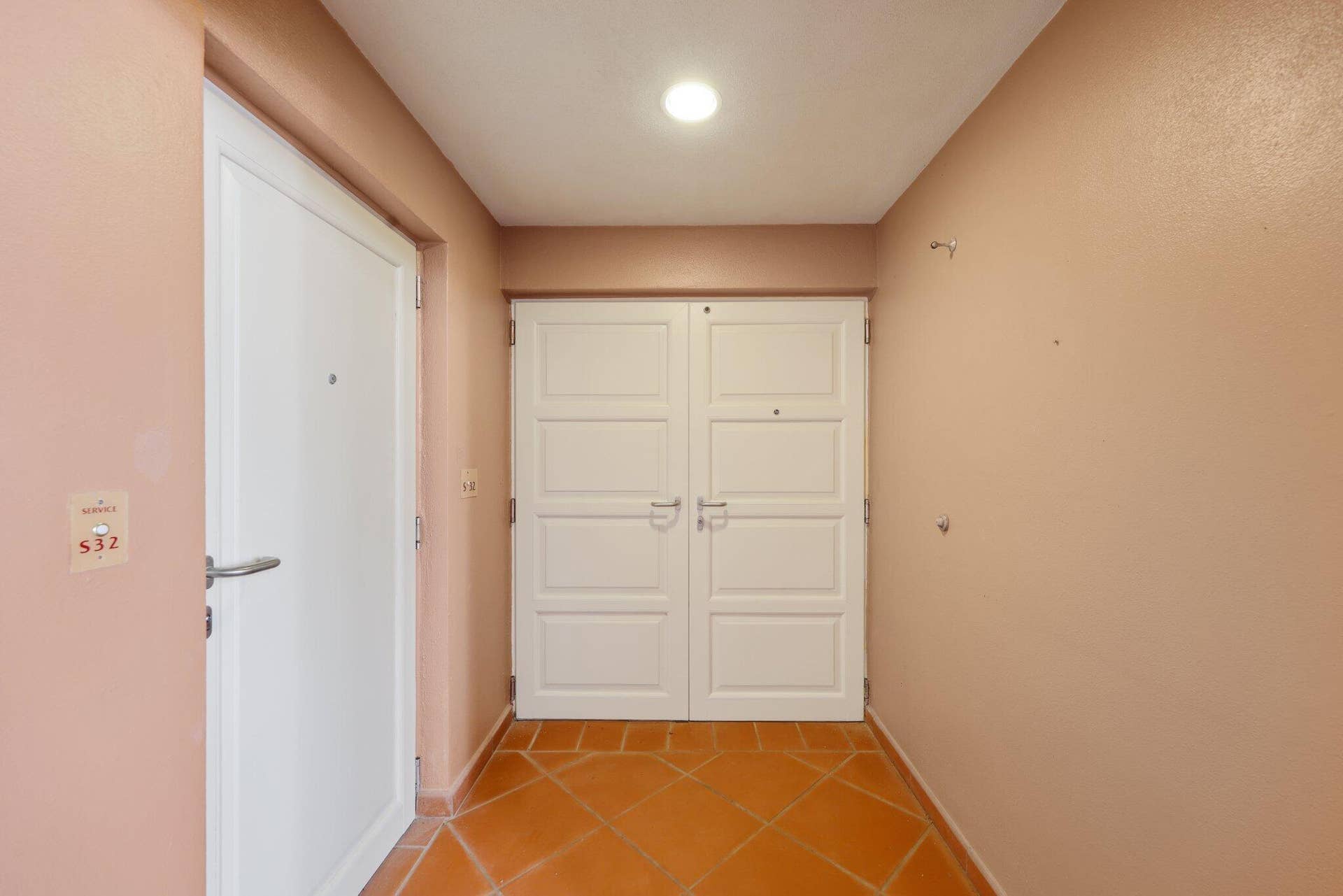 Front Entry to Condominium/Service Door on Side