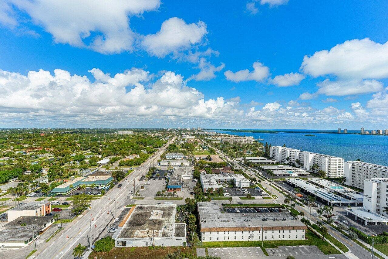 Aerial perspective featuring coastal proximity, expansive water frontage, and surrounding urban infrastructure
