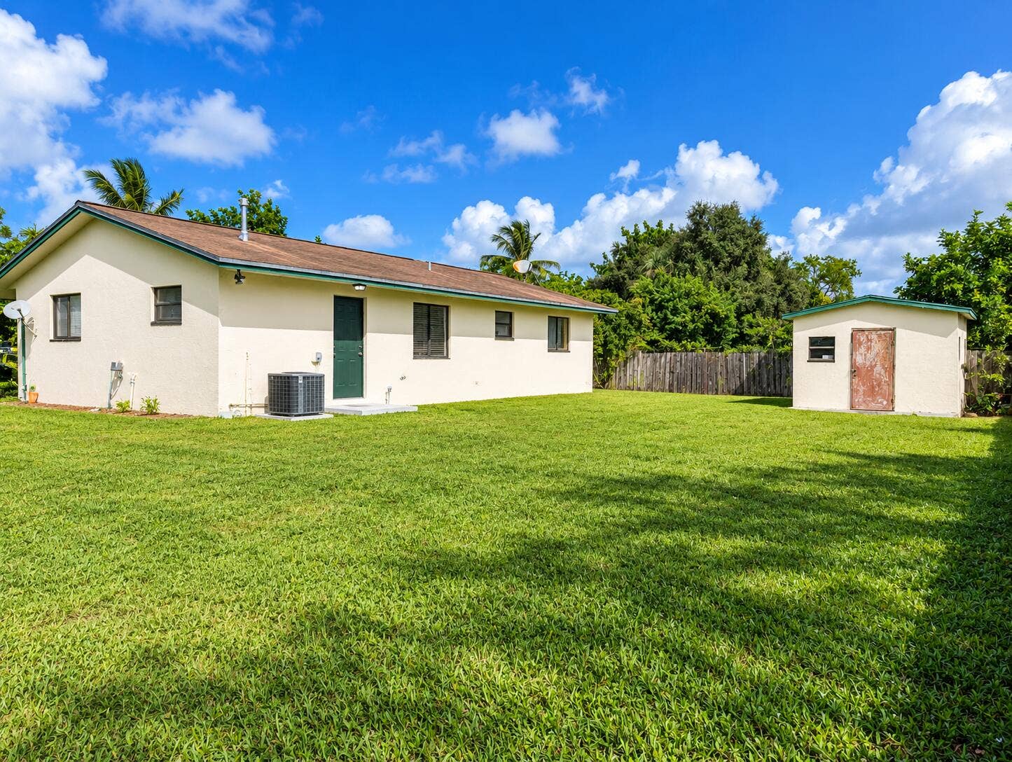 Sunny Tropical Backyard Bungalow and She