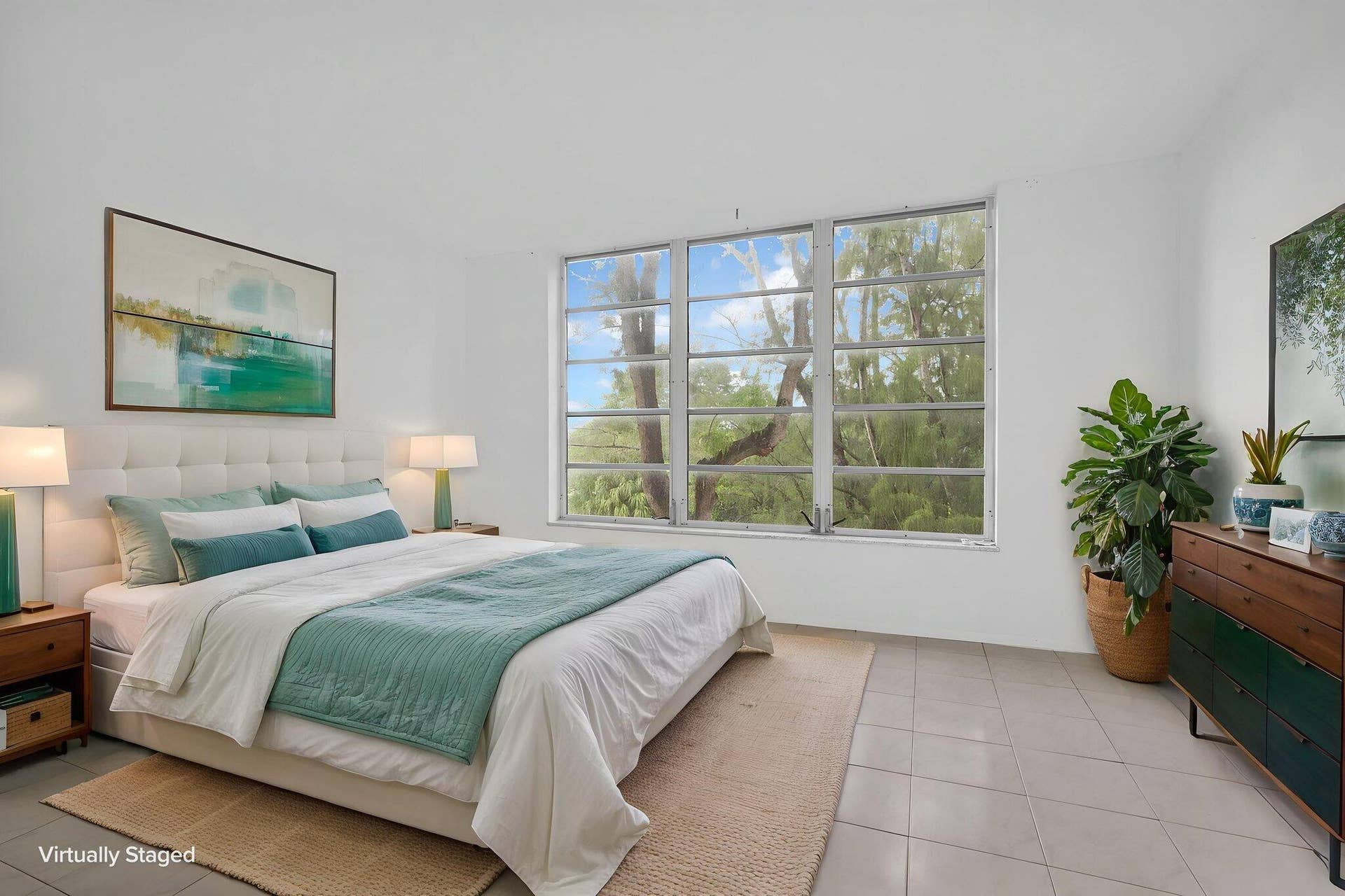 Expansive windows with multi-pane horizontal glazing and neutral tile flooring. Virtual Staged