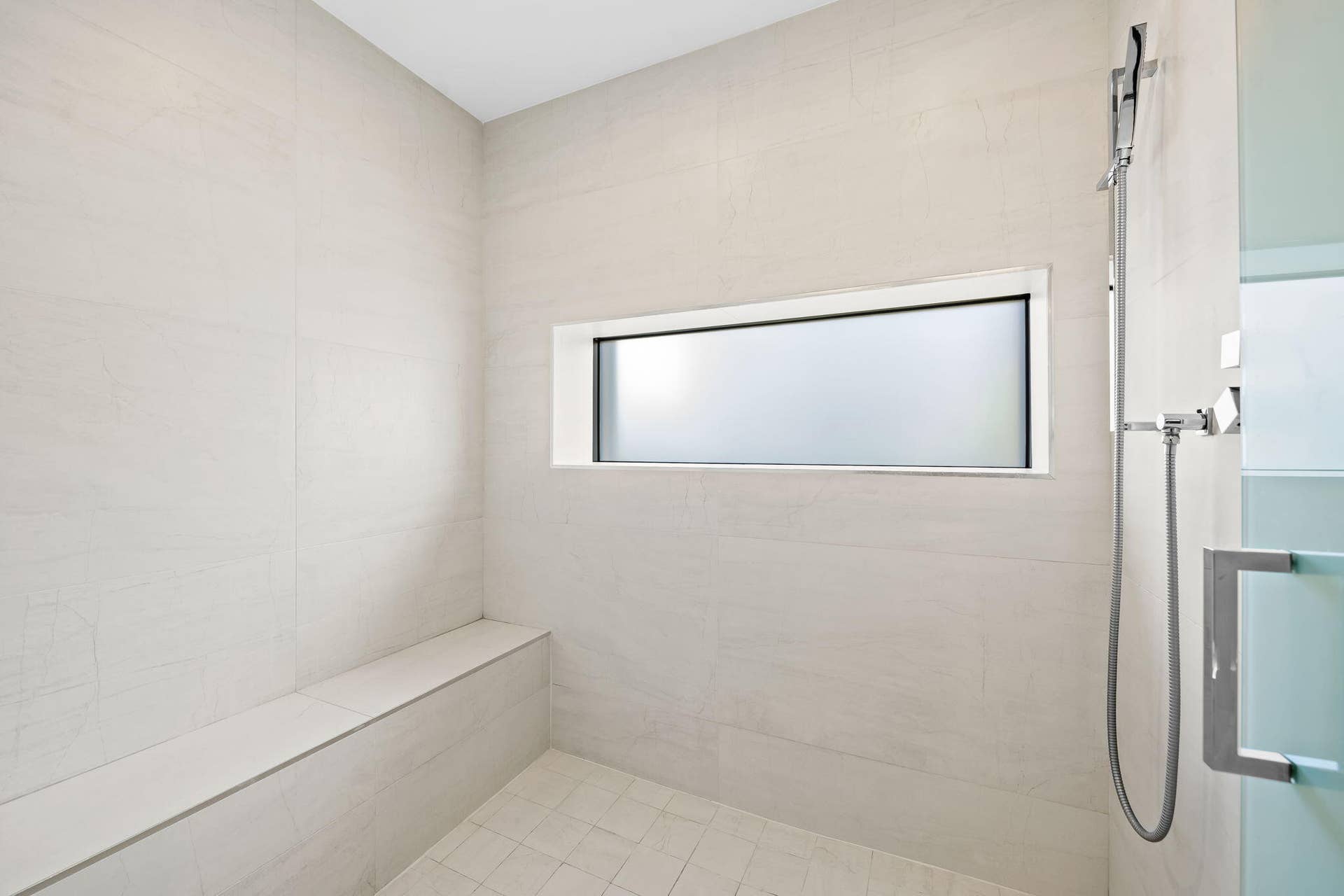 Primary bath shower bench + shampoo niche