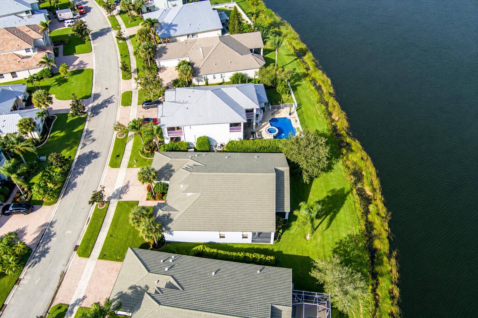 Aerial Waterfront Neighborhood with Pool