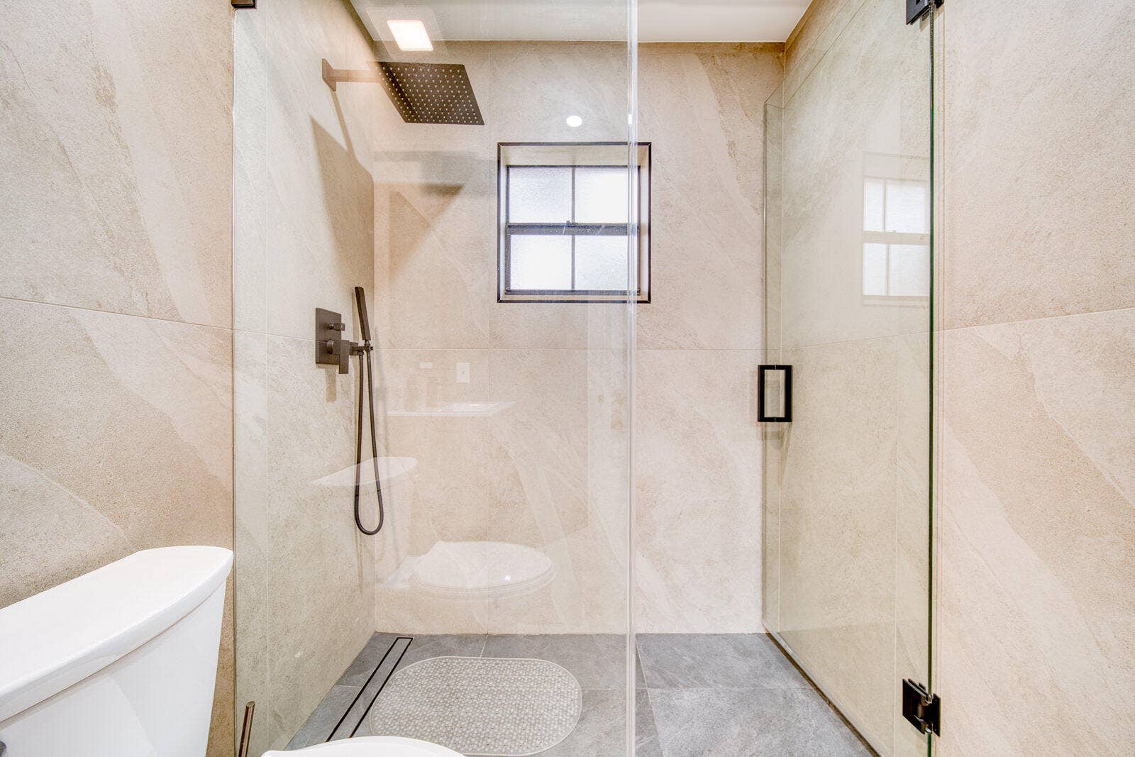 10690 NW 14TH Street, #138, Plantation, FL 33322 Gray and beige porcelain tile with matte black hardware.