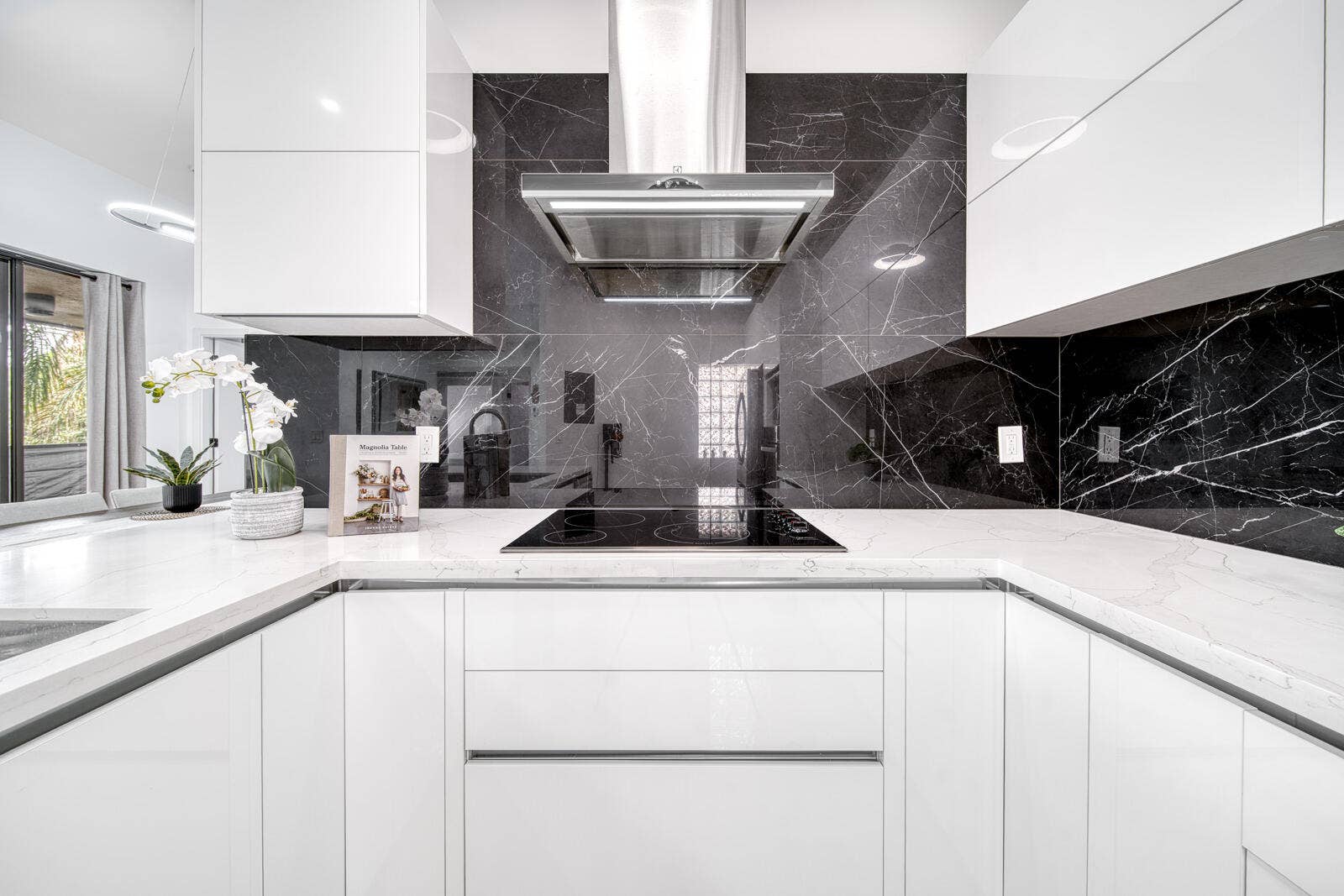 10690 NW 14TH Street, #138, Plantation, FL 33322 Porcelain tile backsplash and sleek cabinetry complete the contemporary design.