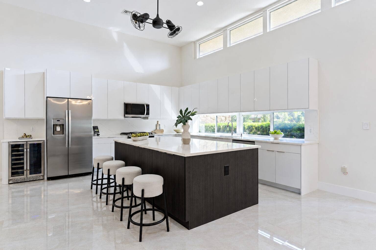 2701 NE 2ND Avenue, Wilton Manors, FL 33334 Modern White Kitchen with Dark Wood Isla
