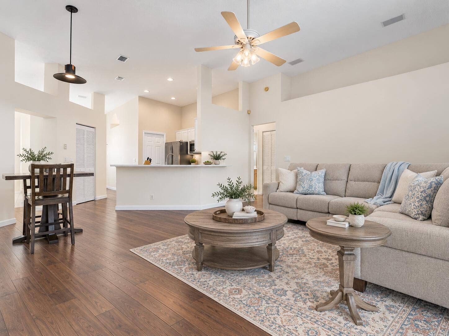 6037 Foster Street, Jupiter, FL 33458 VIRTUALLY STAGED. Family room and kitchen shown with digital furniture, paint and floors to illustrate possible updates.