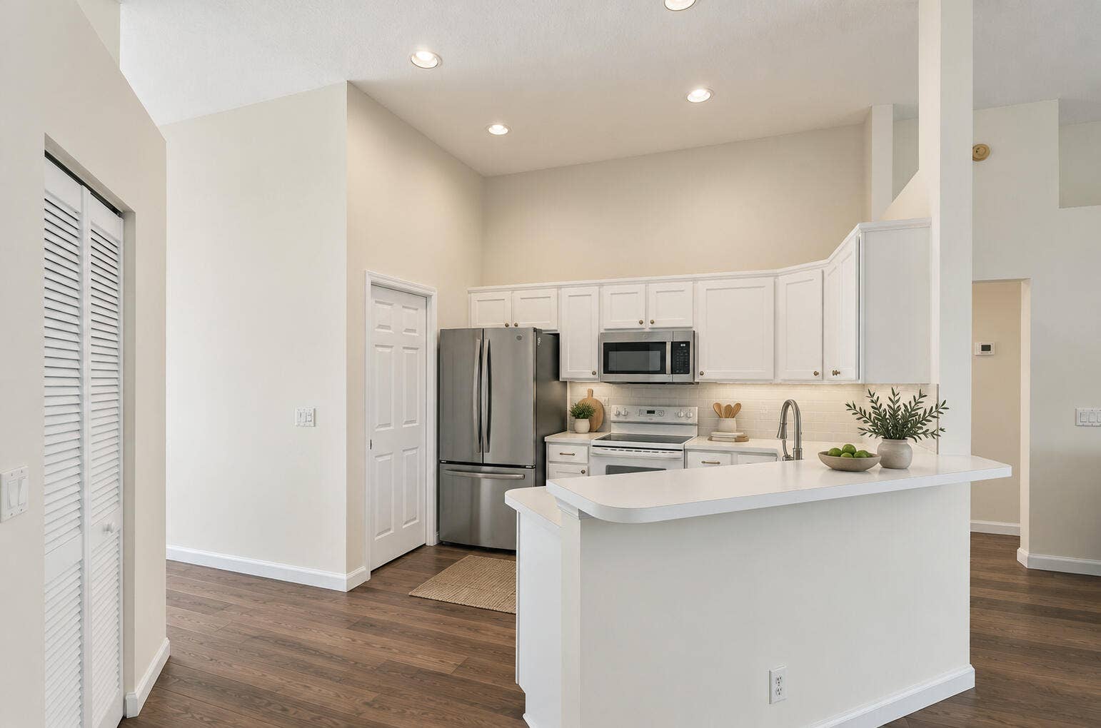 6037 Foster Street, Jupiter, FL 33458 VIRTUALLY STAGED. Kitchen shown with digitally updated paint and floors to illustrate a light refresh.