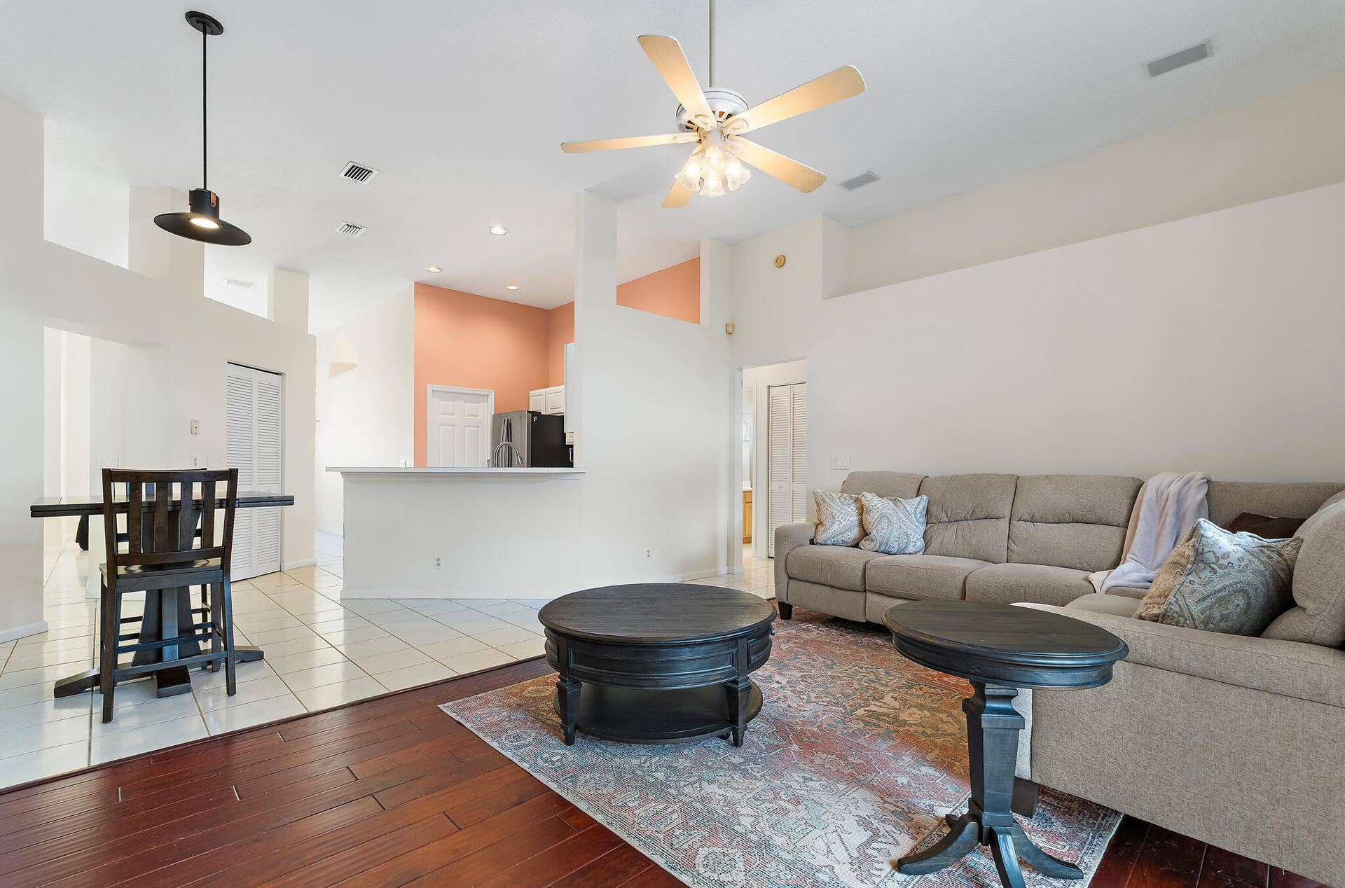 6037 Foster Street, Jupiter, FL 33458 Open family room and dining area with wood floors.