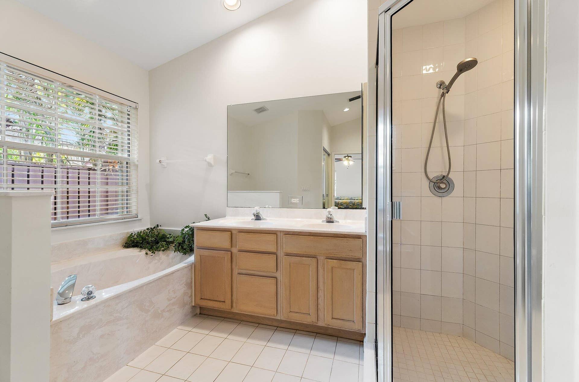 6037 Foster Street, Jupiter, FL 33458 Primary bath with a soaking tub and separate shower.