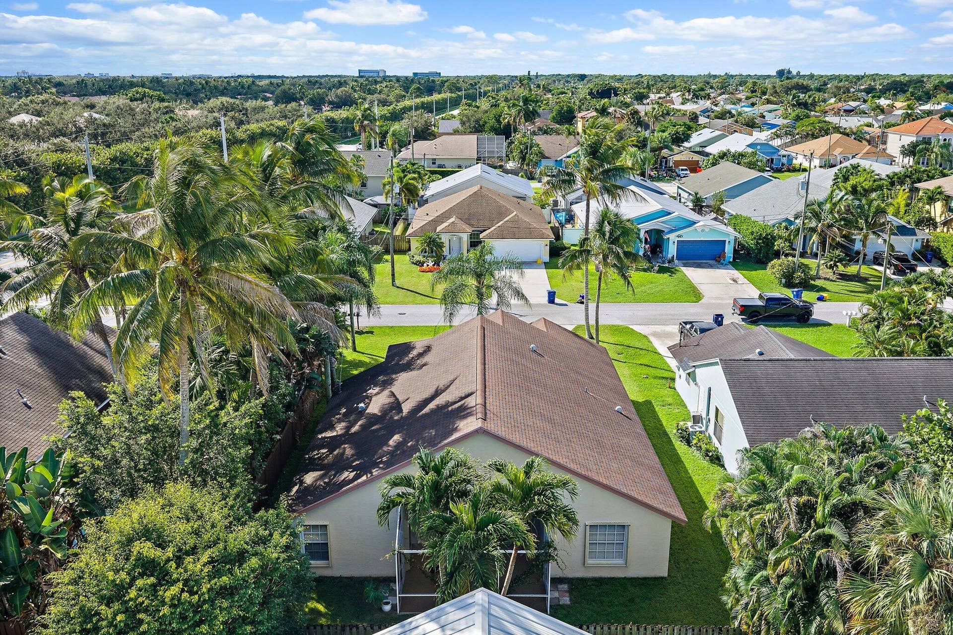 6037 Foster Street, Jupiter, FL 33458 Aerial view of the home and the surrounding Heights of Jupiter neighborhood.