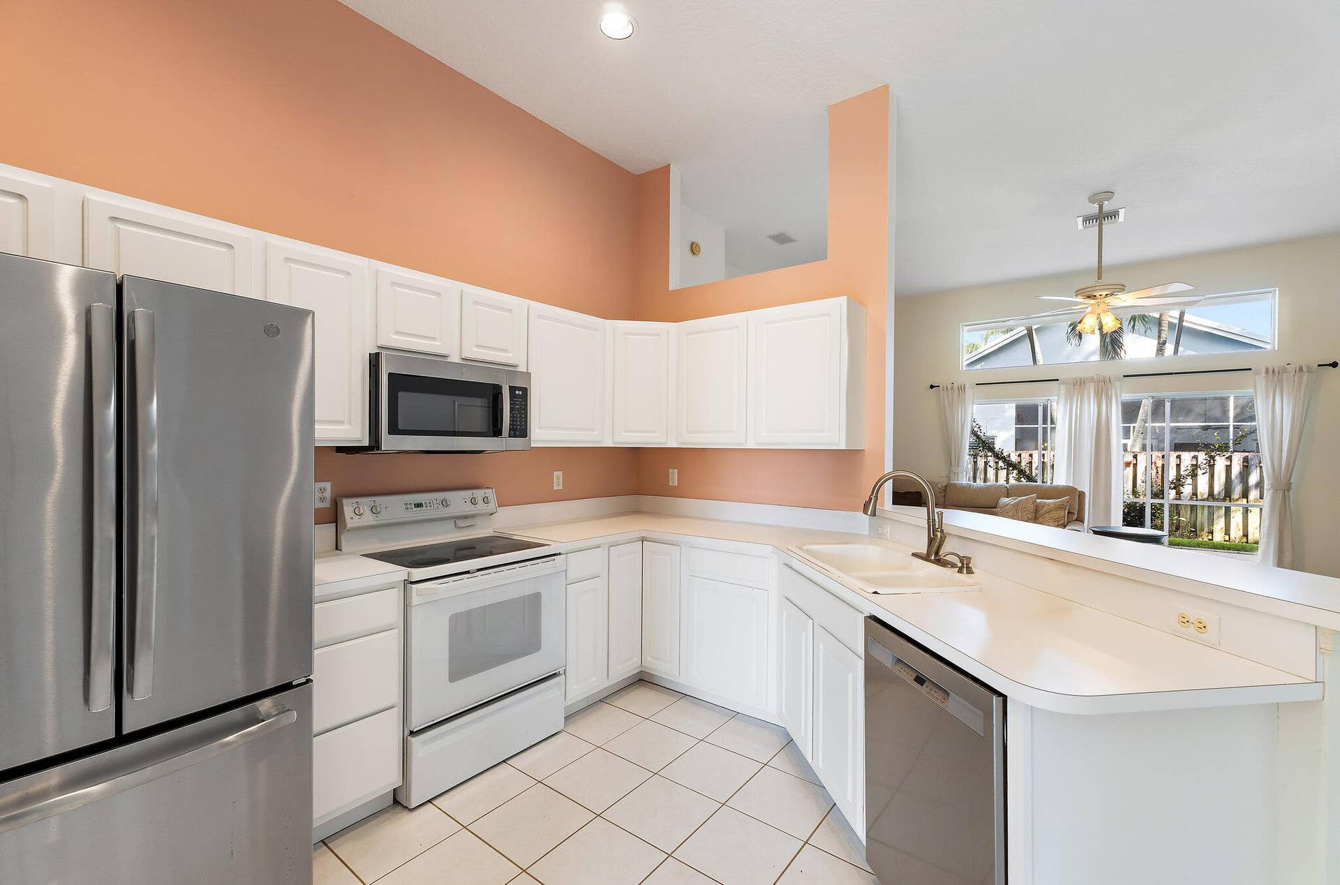 6037 Foster Street, Jupiter, FL 33458 Kitchen with stainless appliances and a window over the sink.
