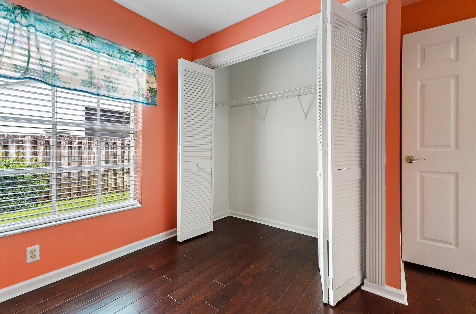 6037 Foster Street, Jupiter, FL 33458 Guest bedroom with wood floors and a closet.