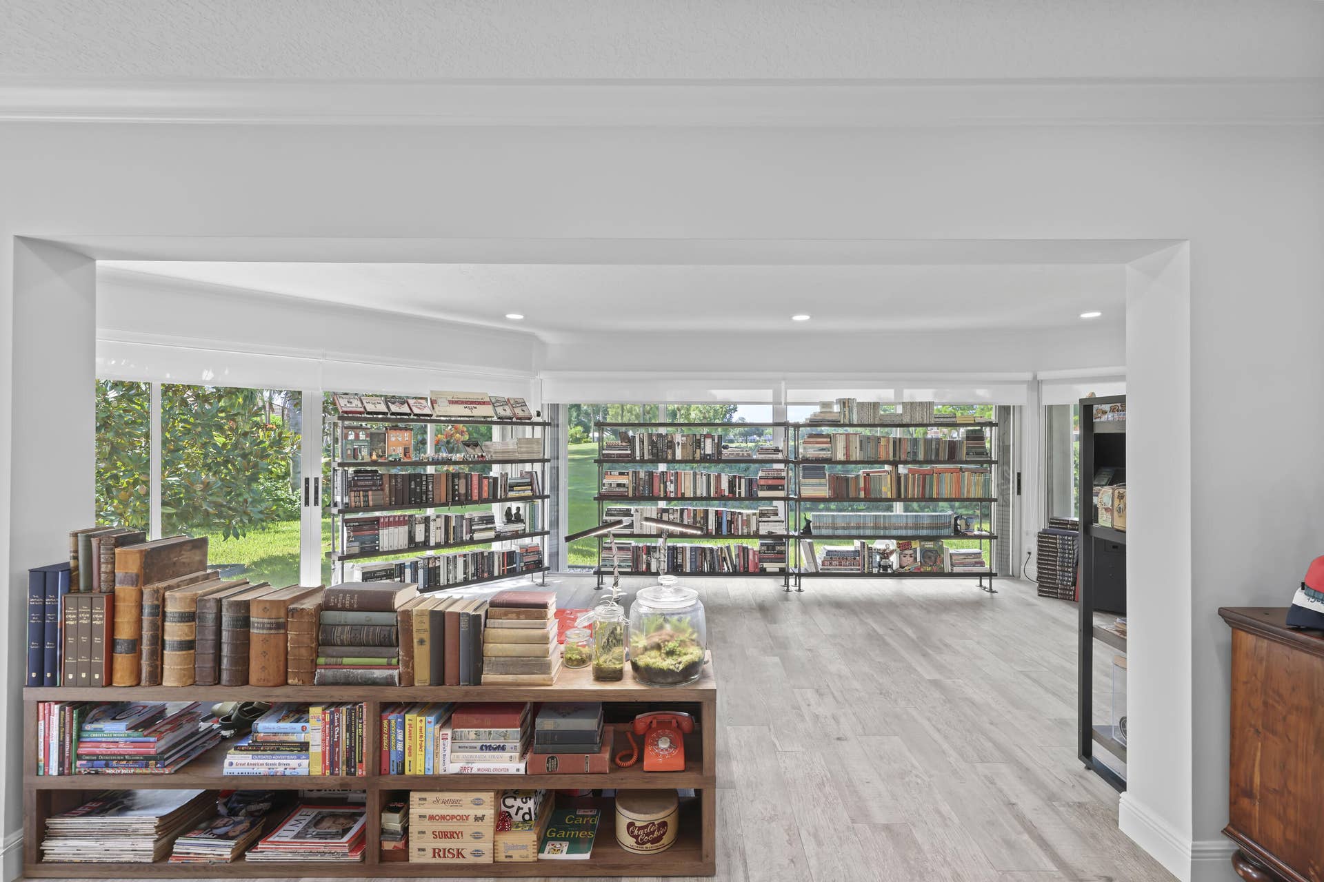 137 Clubhouse Boulevard, Atlantis, FL 33462 Wood-finish flooring, recessed lighting, and extensive floor-to-ceiling windows