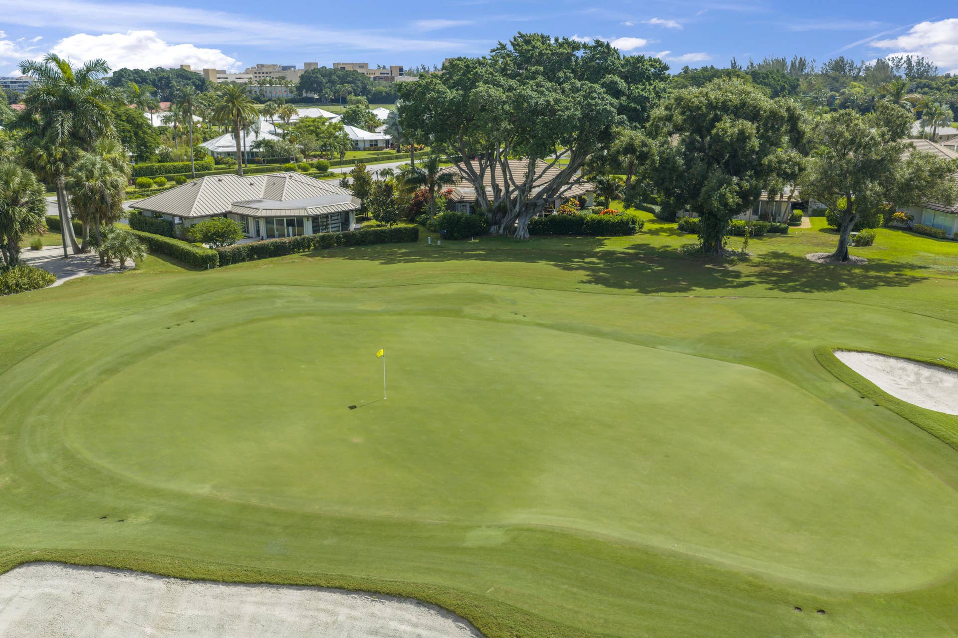 137 Clubhouse Boulevard, Atlantis, FL 33462 Golf course lot featuring expansive green fairways, sand bunkers, and mature specimen trees
