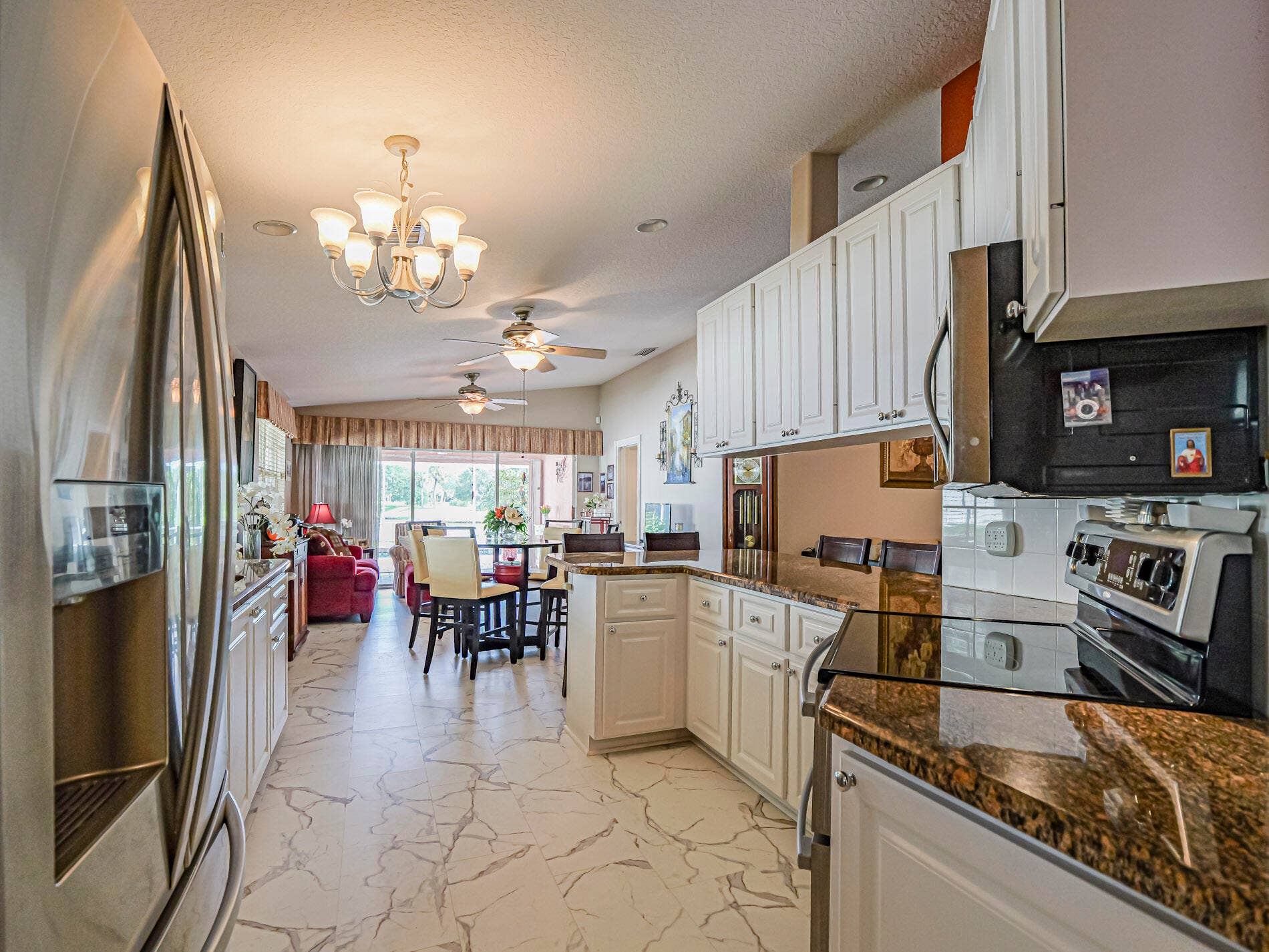 Kitchen opens to Living and Family Rooms