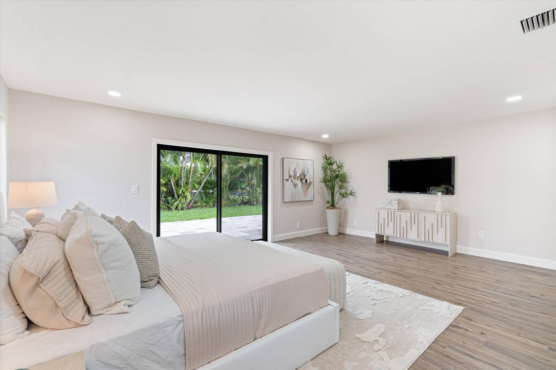 6111 WHITE OAK Lane, Tamarac, FL 33319 Interior space featuring wood-finish flooring, recessed lighting, and large sliding glass doors