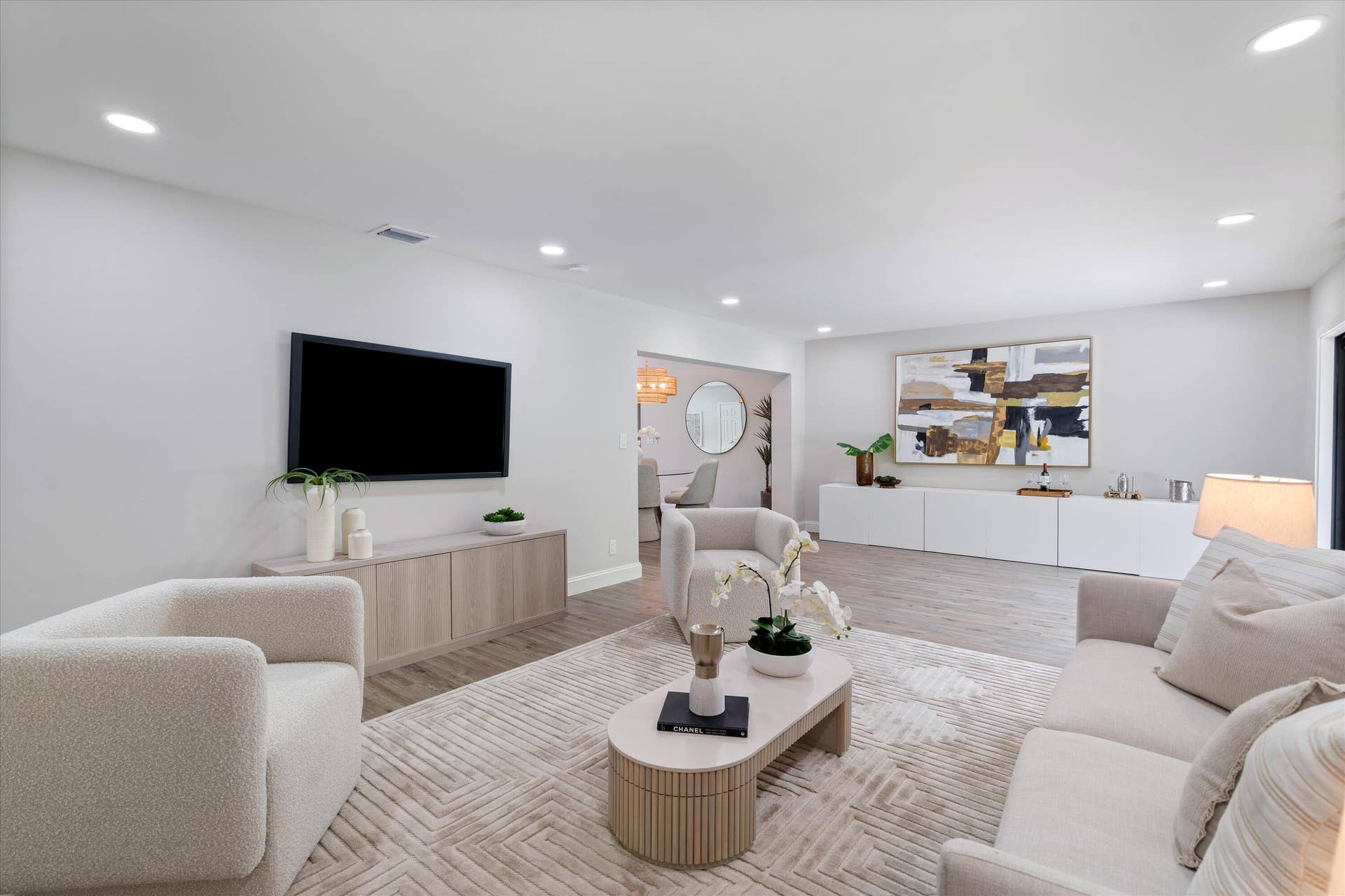 6111 WHITE OAK Lane, Tamarac, FL 33319 Living area featuring wood-finish flooring, recessed lighting, and built-in white cabinetry