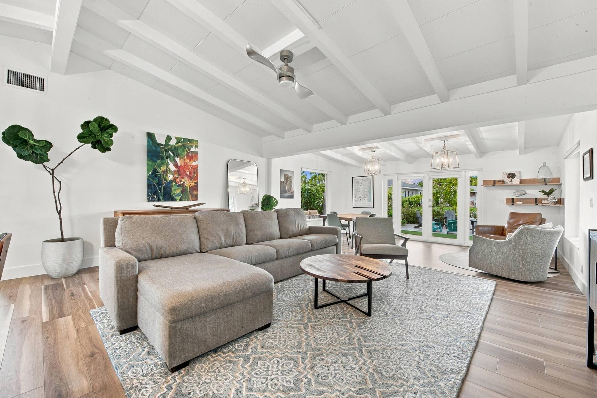 2449 KEY LARGO Lane, Fort Lauderdale, FL 33312 Vaulted ceiling with exposed beams, wood-finish flooring, ceiling fan, and double glass-paneled exterior doors