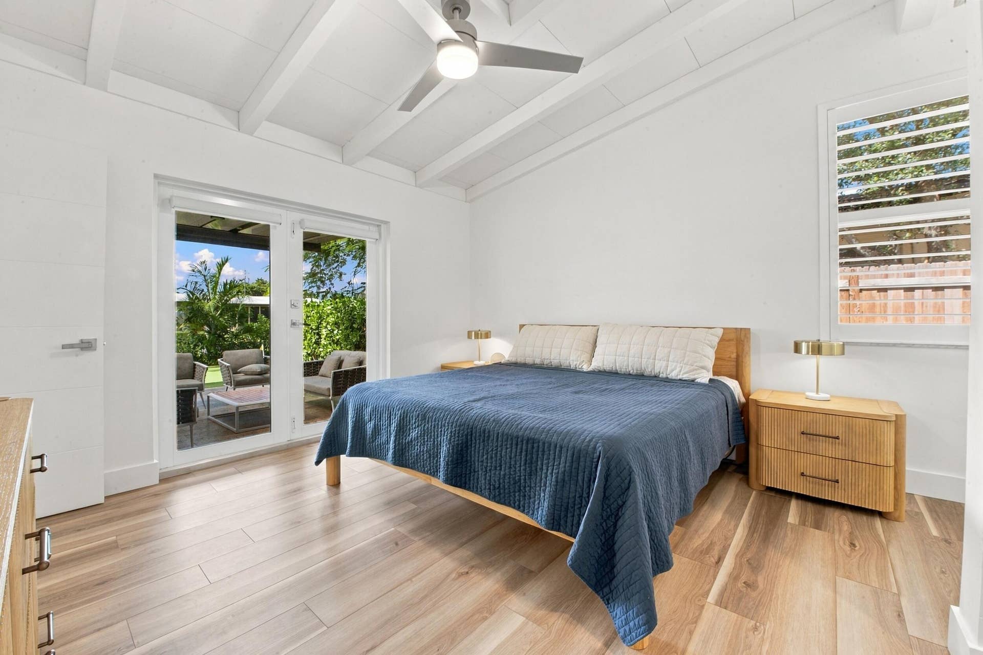 2449 KEY LARGO Lane, Fort Lauderdale, FL 33312 Room featuring wood-finish flooring, vaulted ceilings with exposed beams, a ceiling fan, and French doors providing exterior access