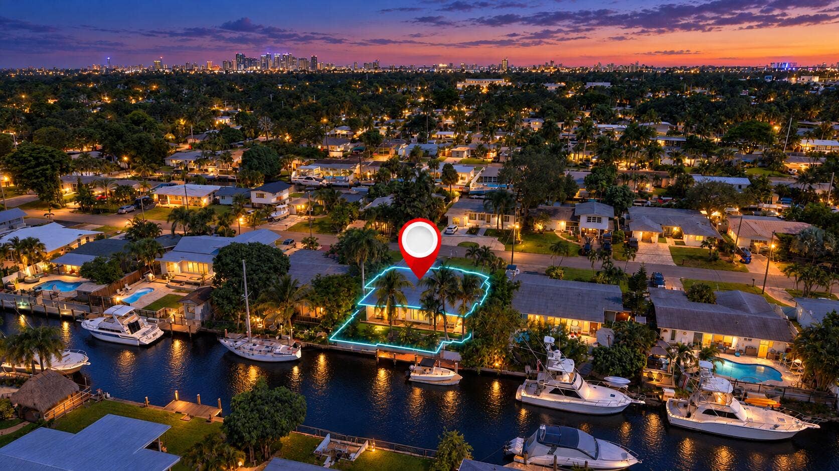 2449 KEY LARGO Lane, Fort Lauderdale, FL 33312 Twilight canal neighborhood with glowing
