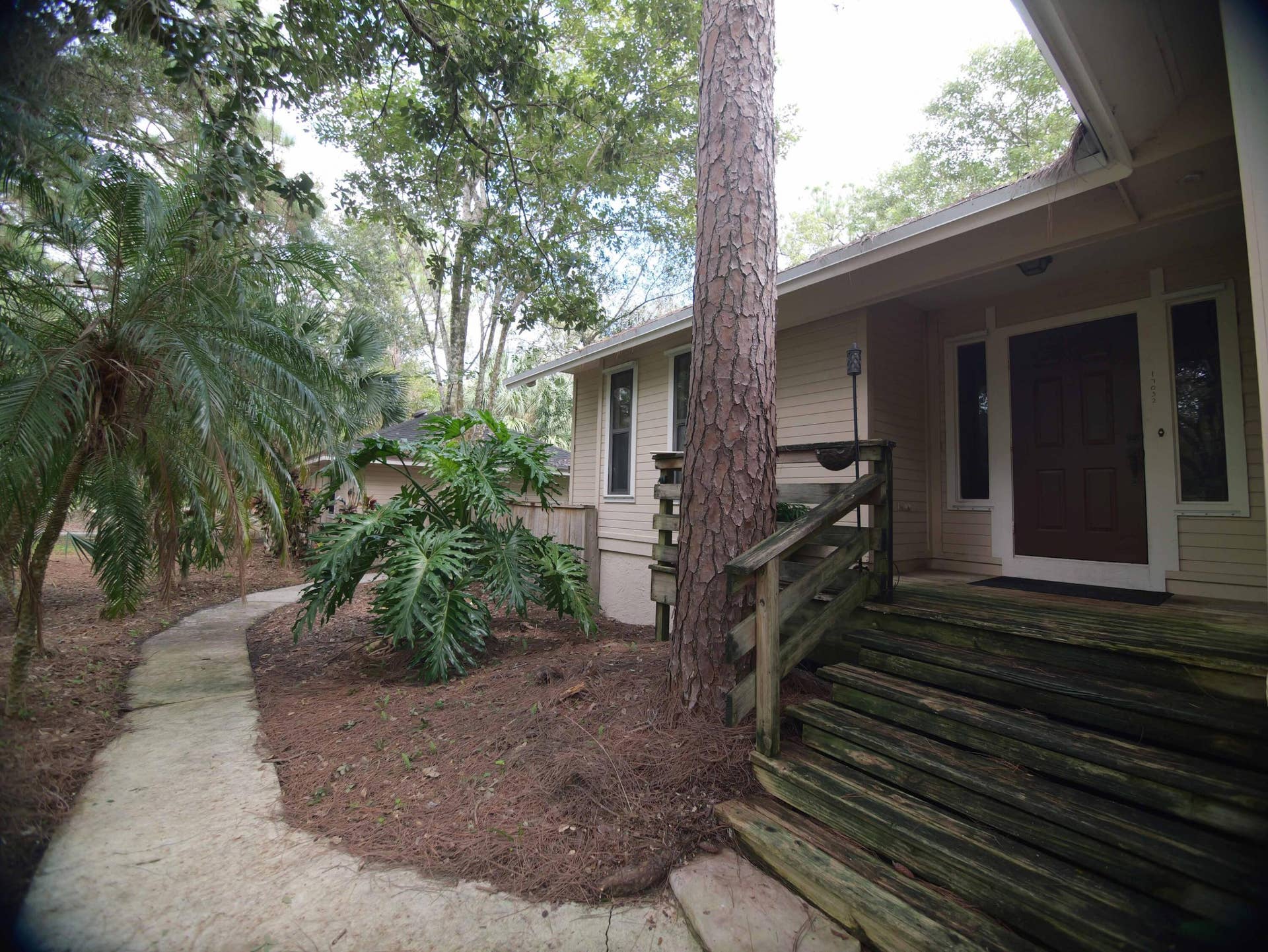 17032 130TH Avenue N, Jupiter, FL 33478 Front door & path to Garage